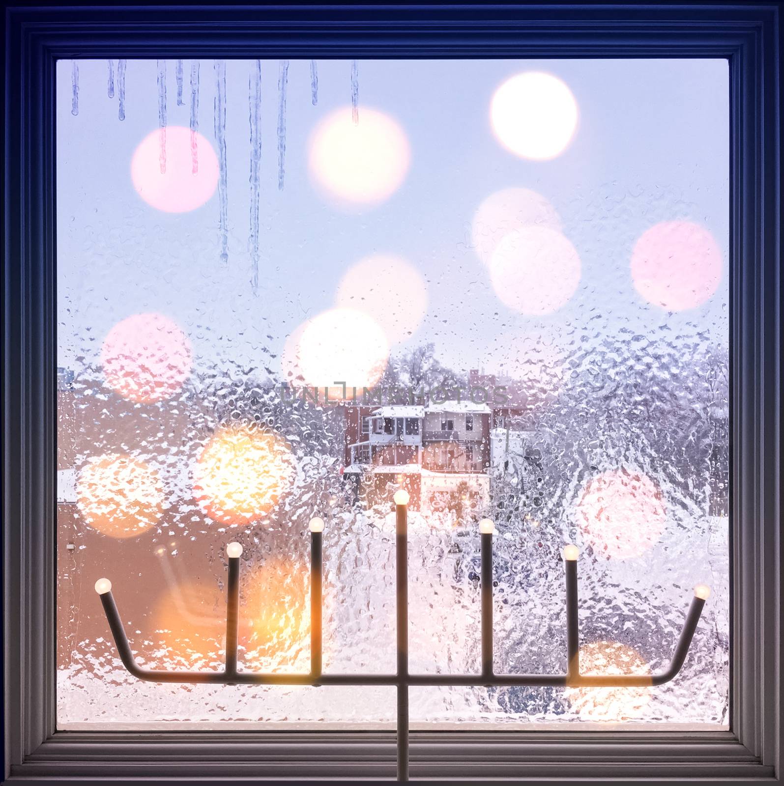 Winter composition with frosted window and lights. Christmas mood.