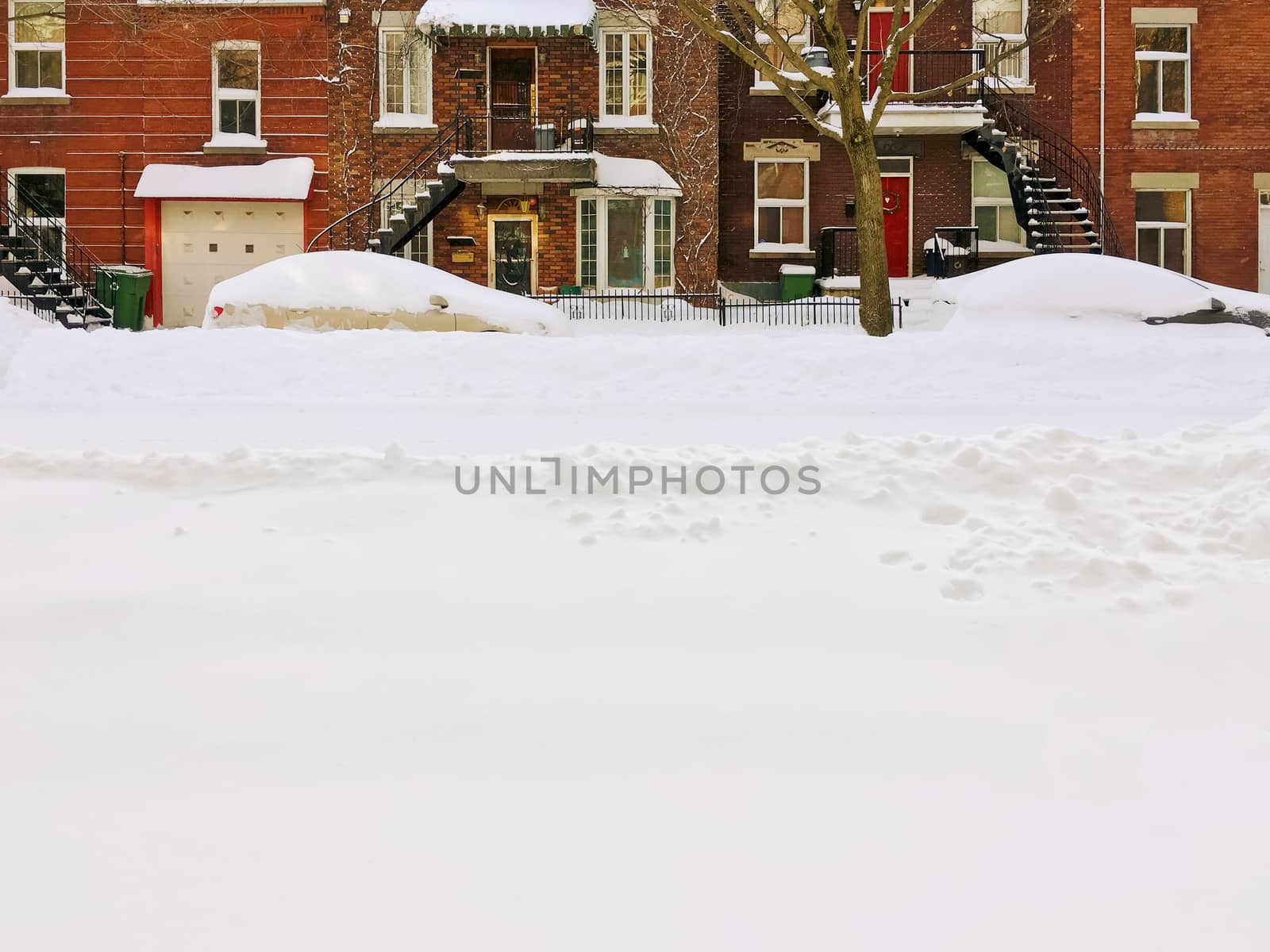 Urban winter street after snowstorm, with space for text. Montreal, Quebec, Canada.