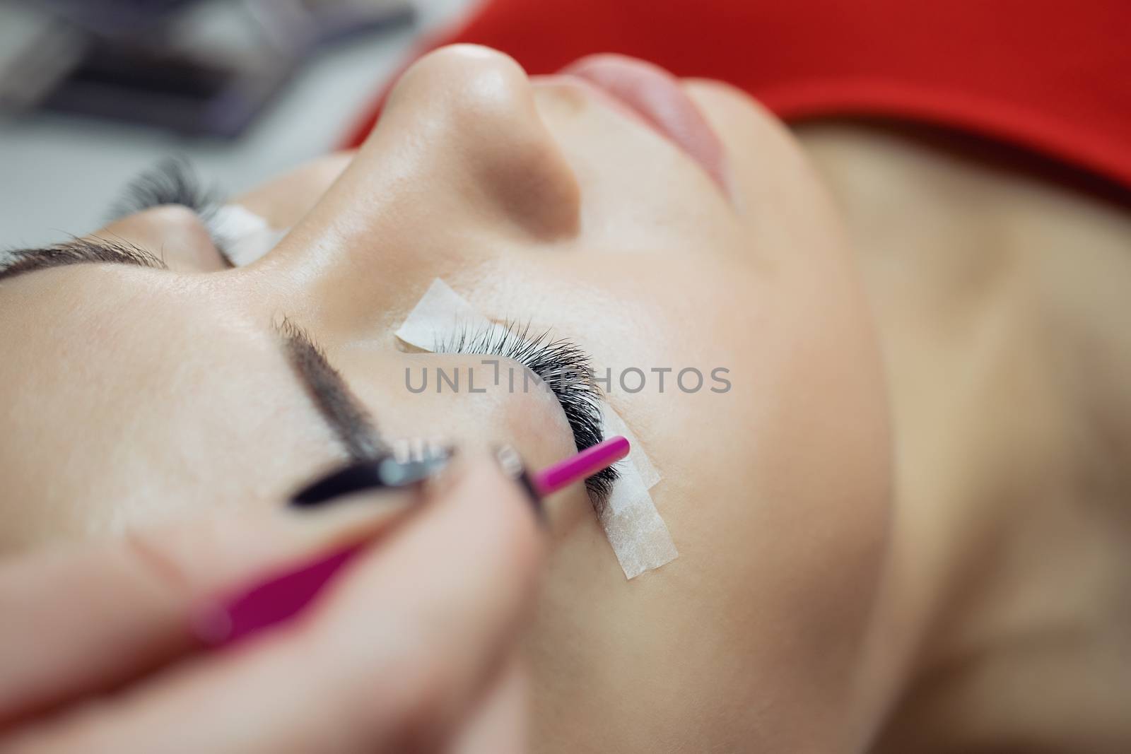 Eyelash Extension Procedure. Woman Eye with Long Eyelashes. by 3KStudio