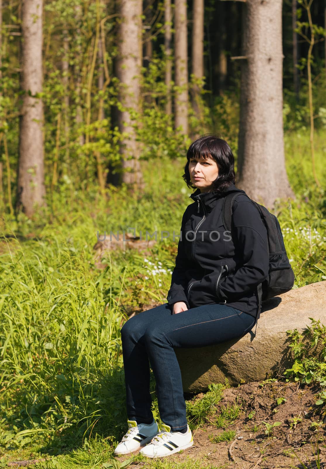 woman, on hiking trip resting by artush