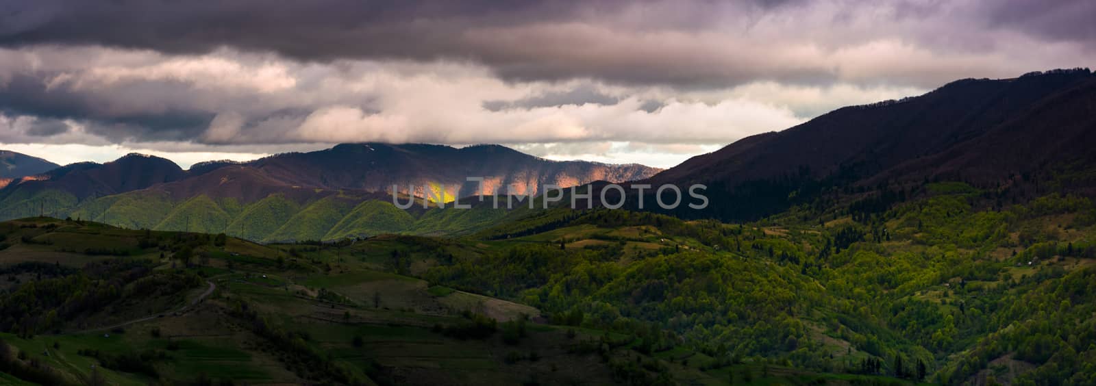 cloudy sunset in mountainous countryside by Pellinni