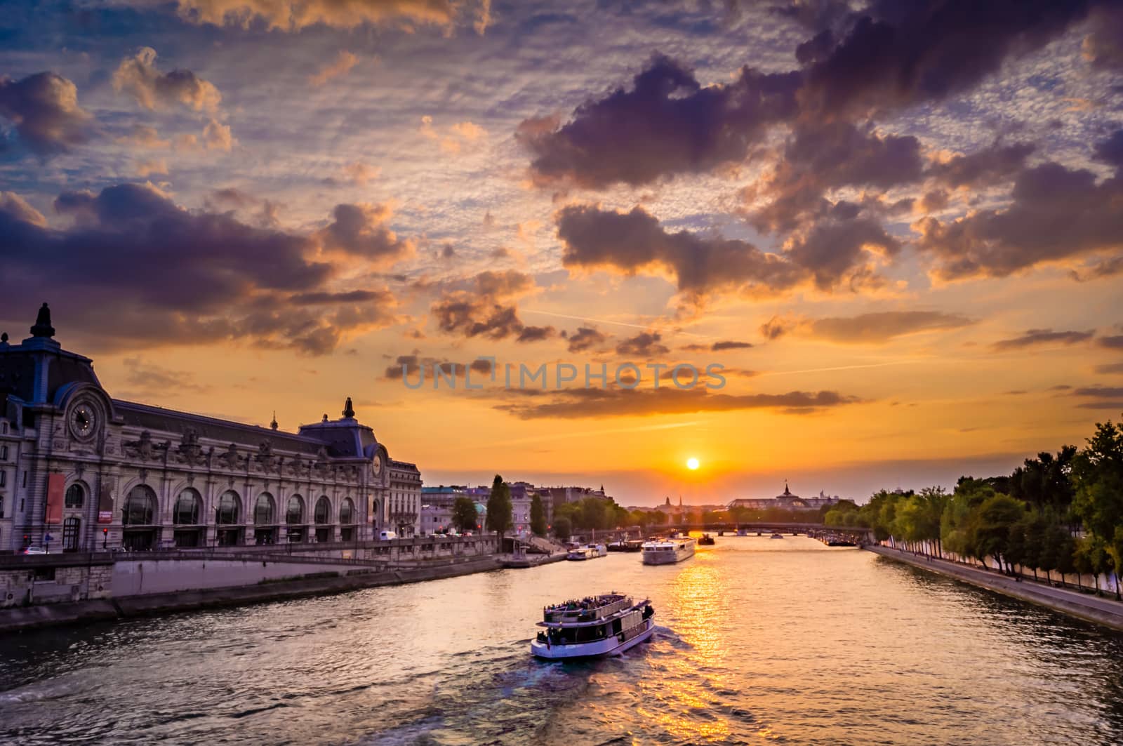 Sunset over Orsay Museum and Seine river in Paris