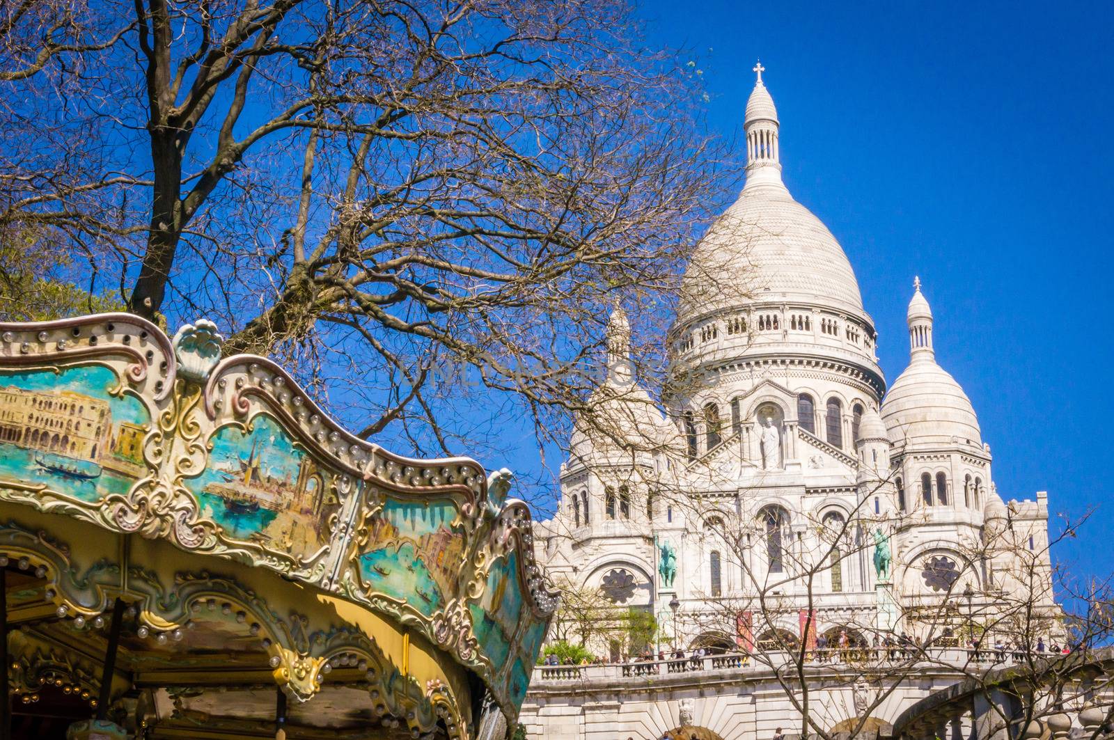 Sacre coeur and merry-go-round in Montmartre by bignoub