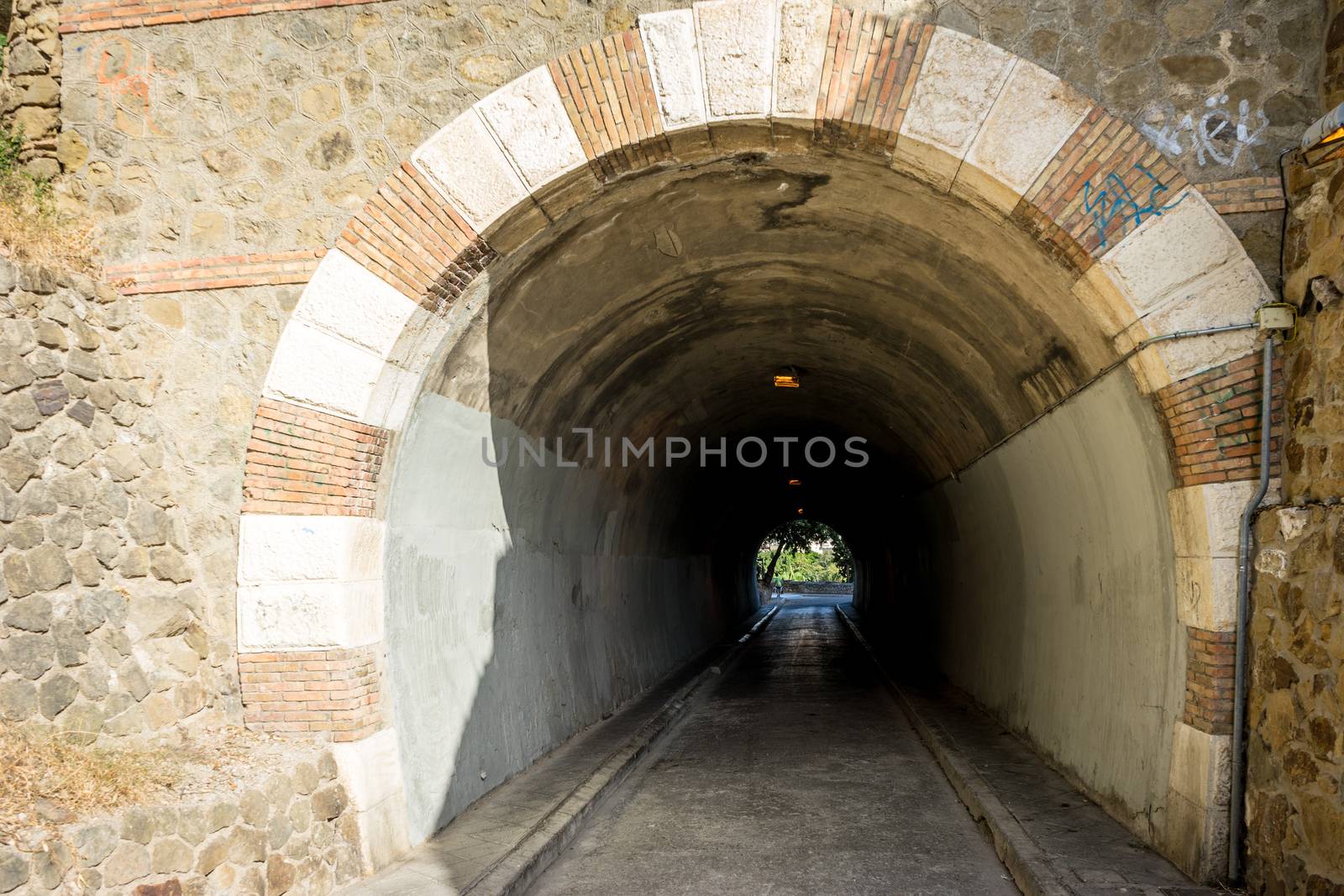 Tunnel in the hill overlooking the city of malaga, Spain, Europe on a bright summer day