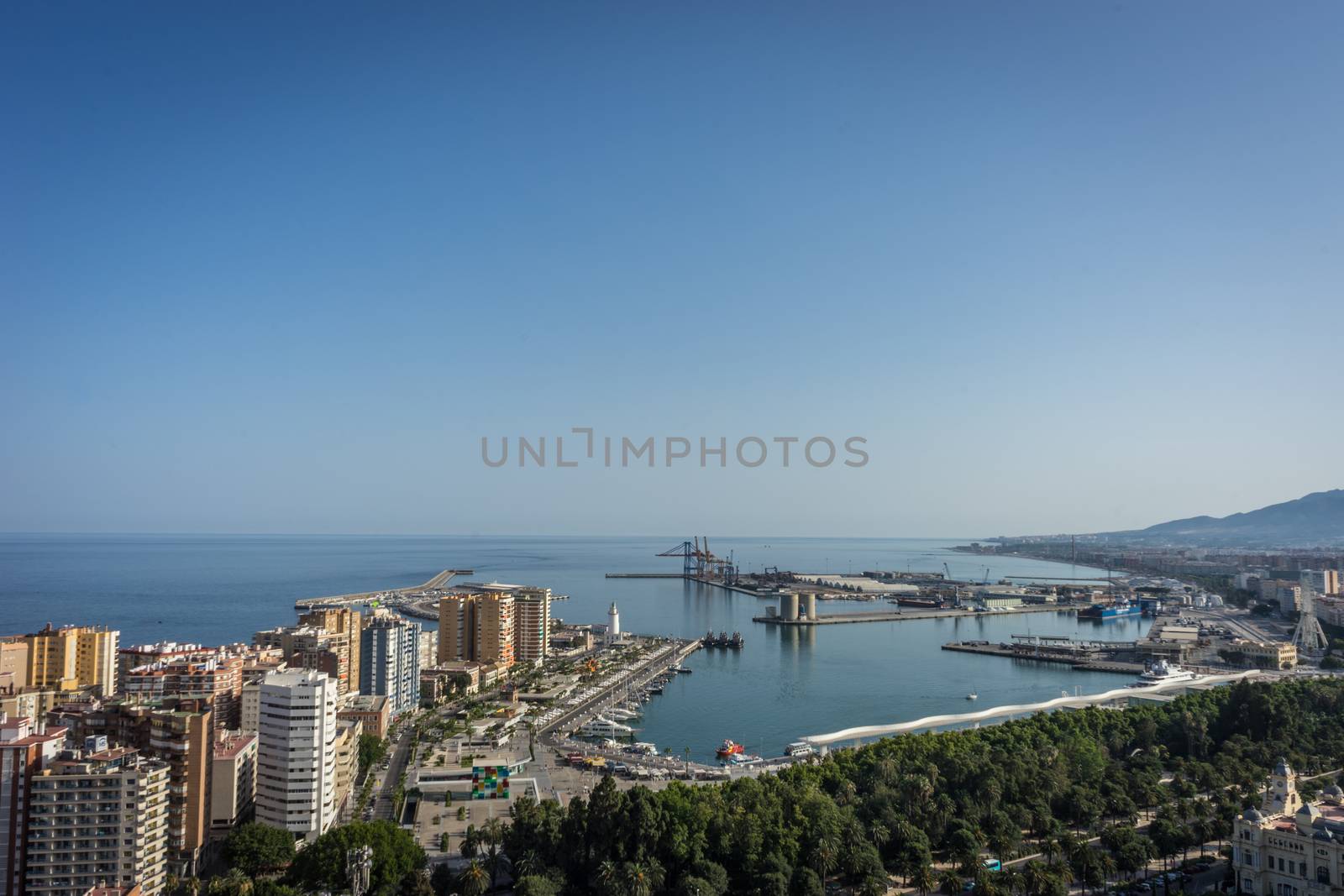 City skyline and harbour, sea port of Malaga overlooking the sea by ramana16