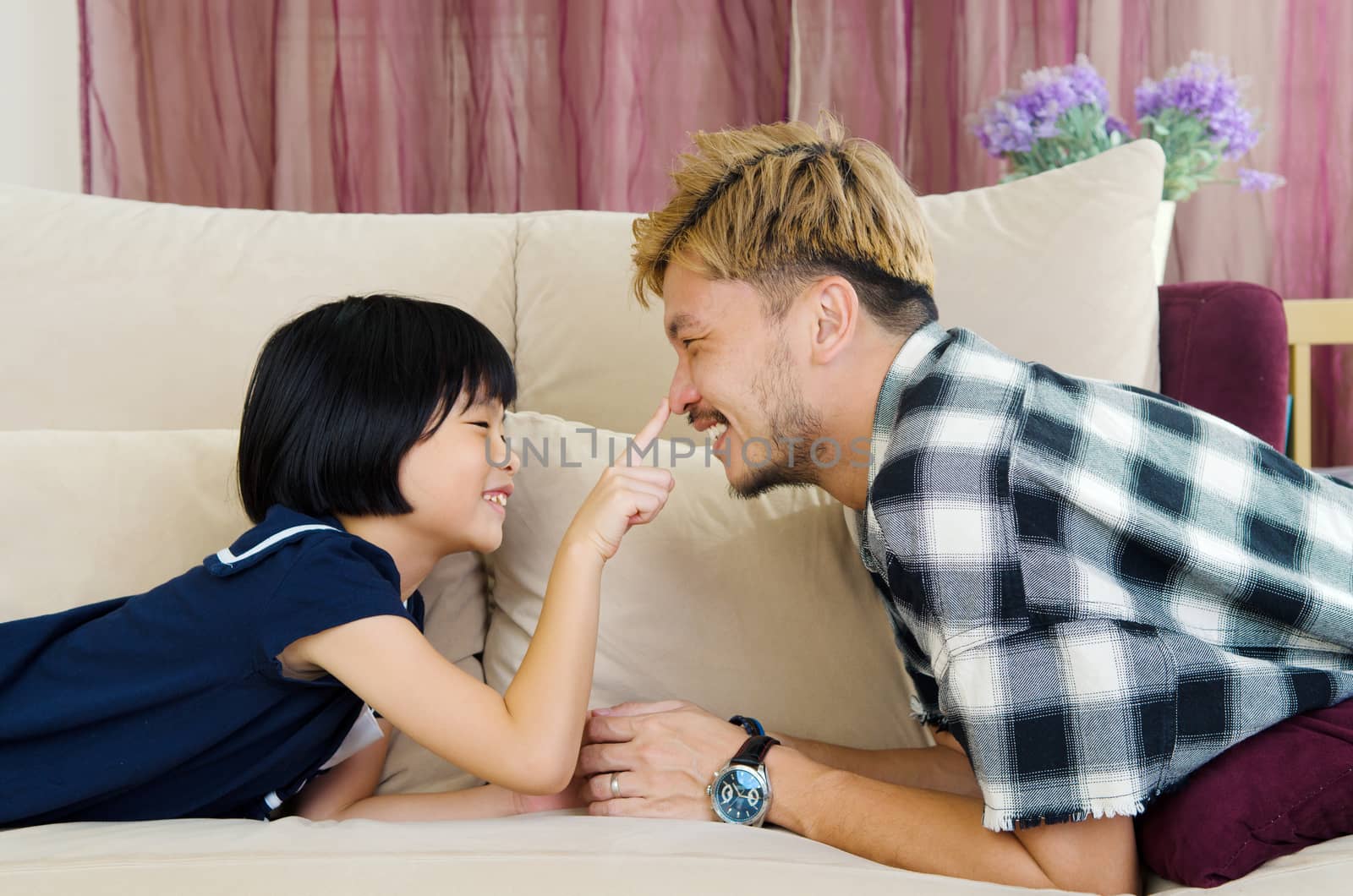 Asian father and his cute little girl