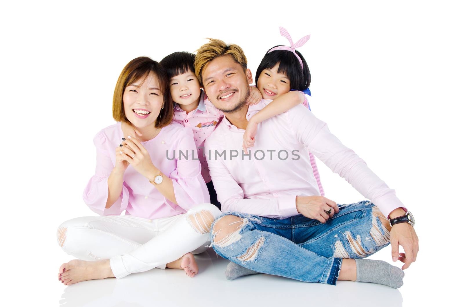 Indoor portrait of a happy asian family
