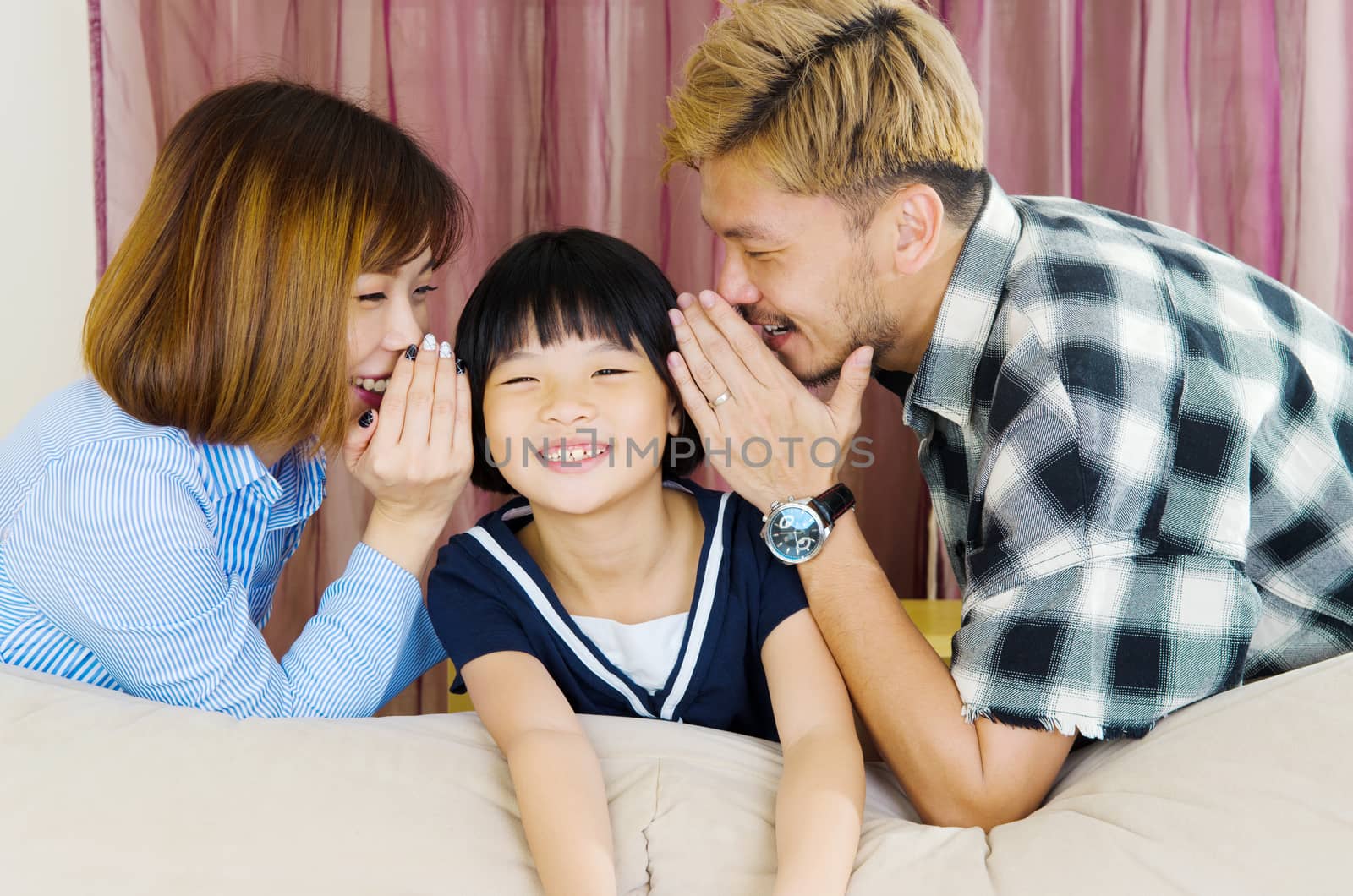 happy asian family in the living room