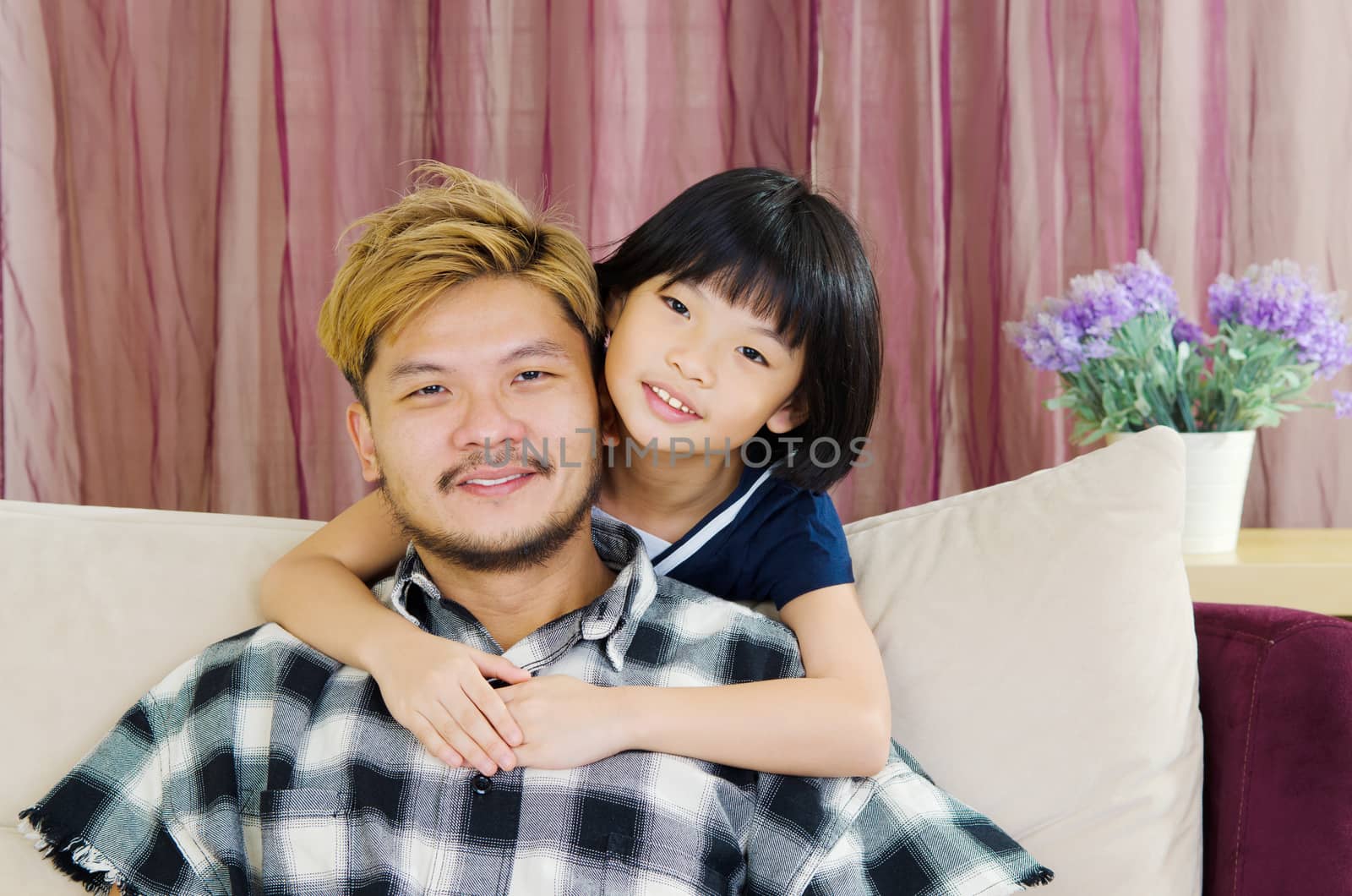 happy asian family in the living room