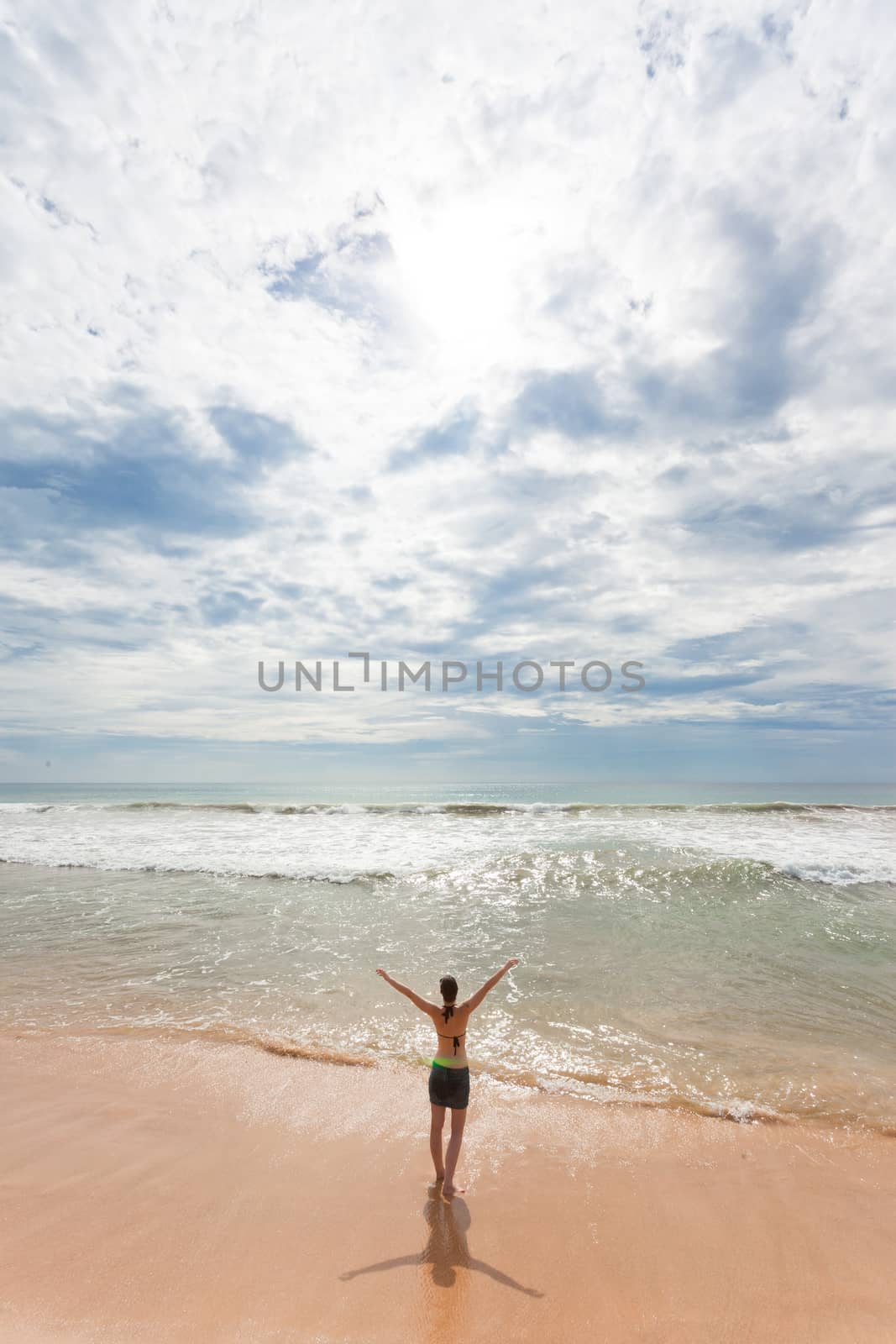 Asia - Sri Lanka - Ahungalla - A woman enjoying the sunshine at the beach