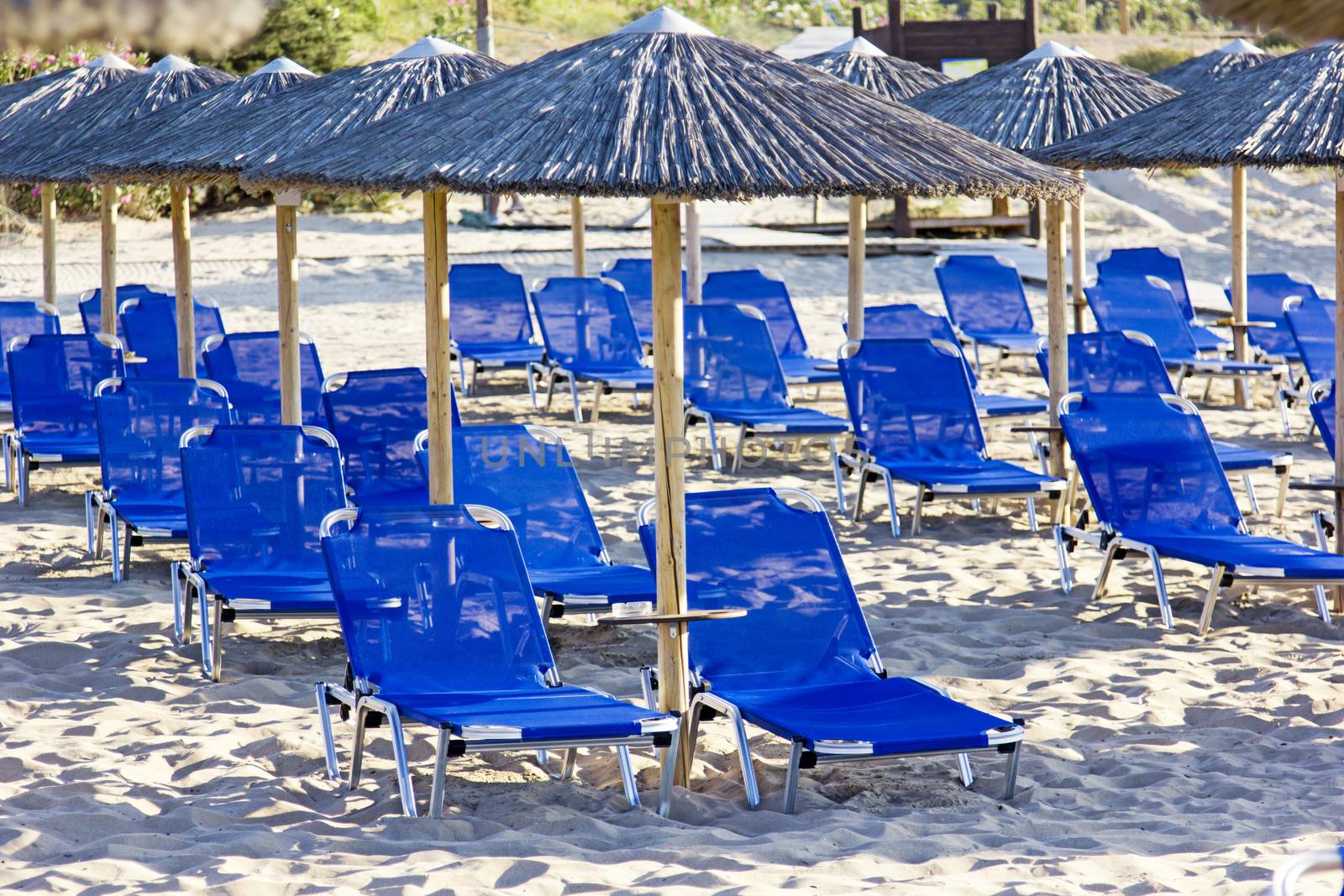 Sunbeds and umbrella on a tropical beach