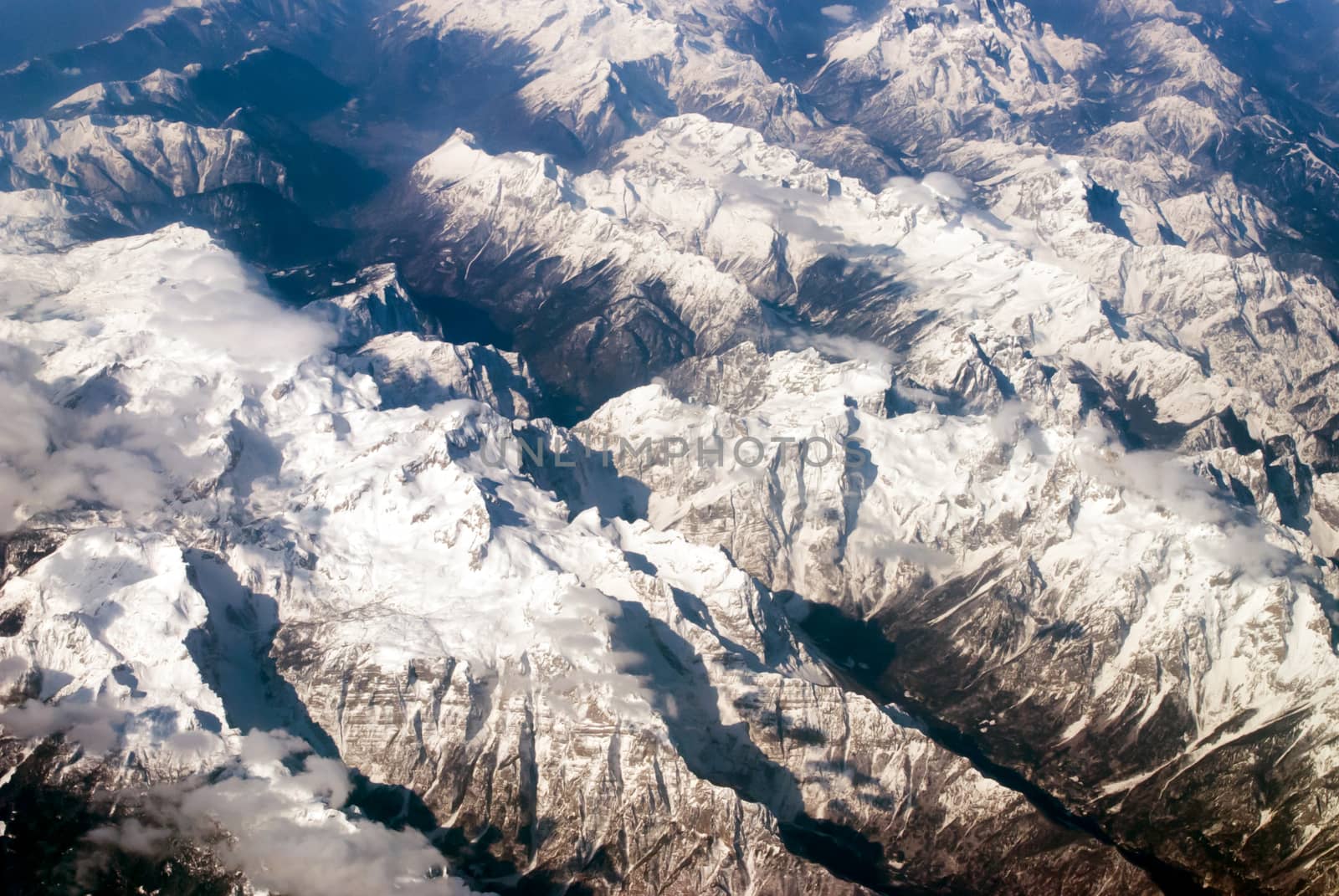 aerial view of mountains and clouds on top 