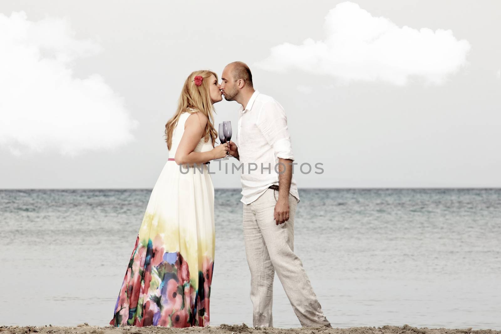 portrait of a young couple at the beach having romance
