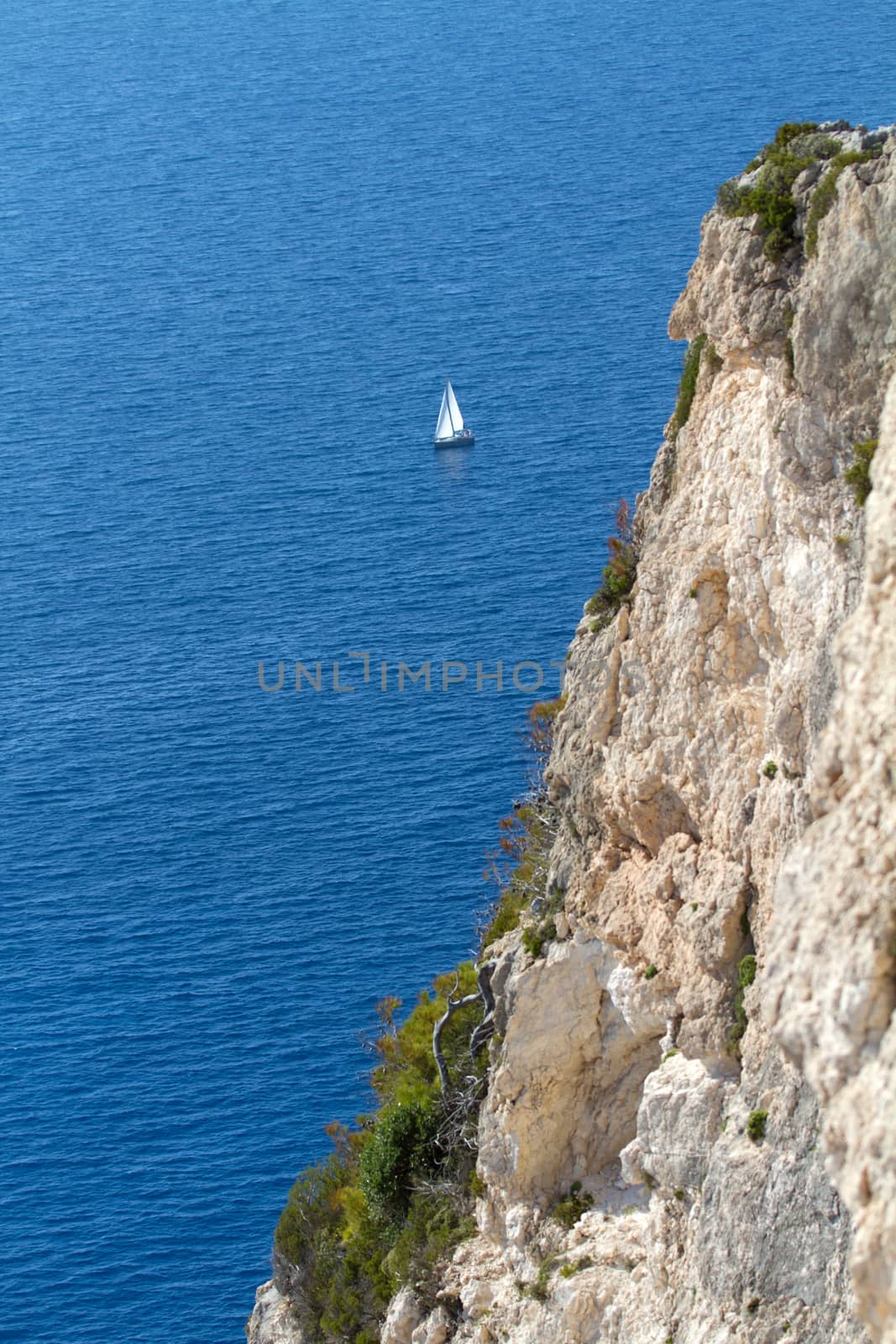 sail boat traveling in the beautiful blue sea