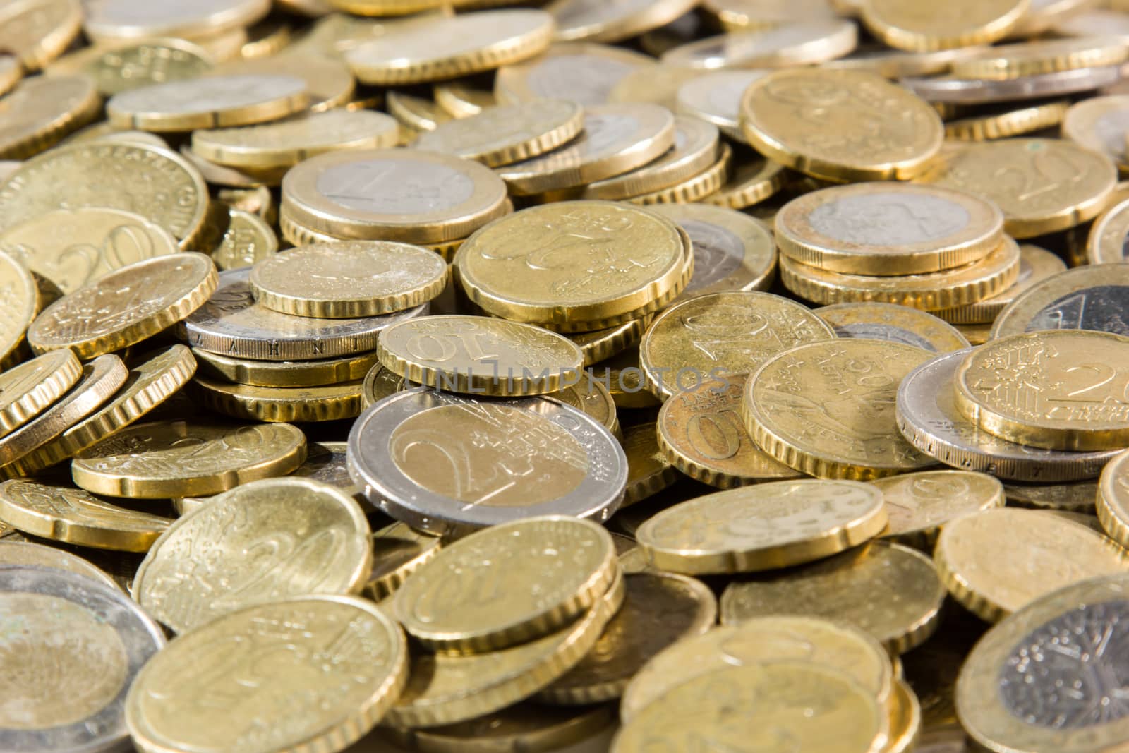 heap of euros coins isolated on a white background