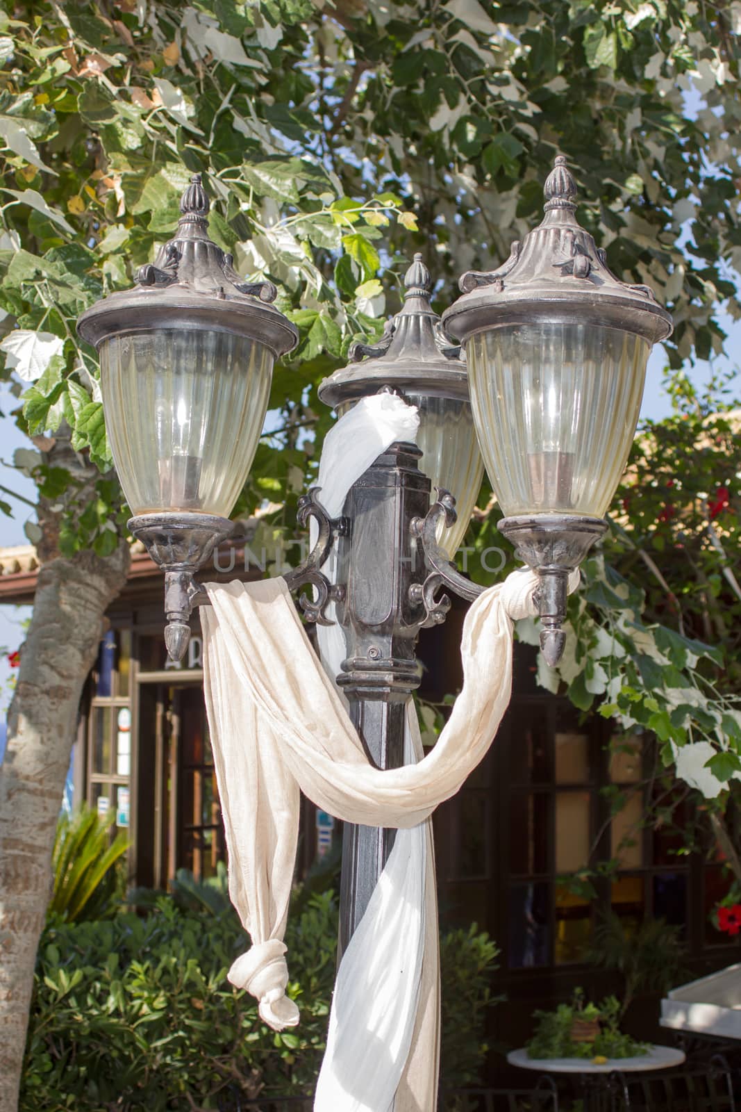 closeup of a lantern decorated with white cloth