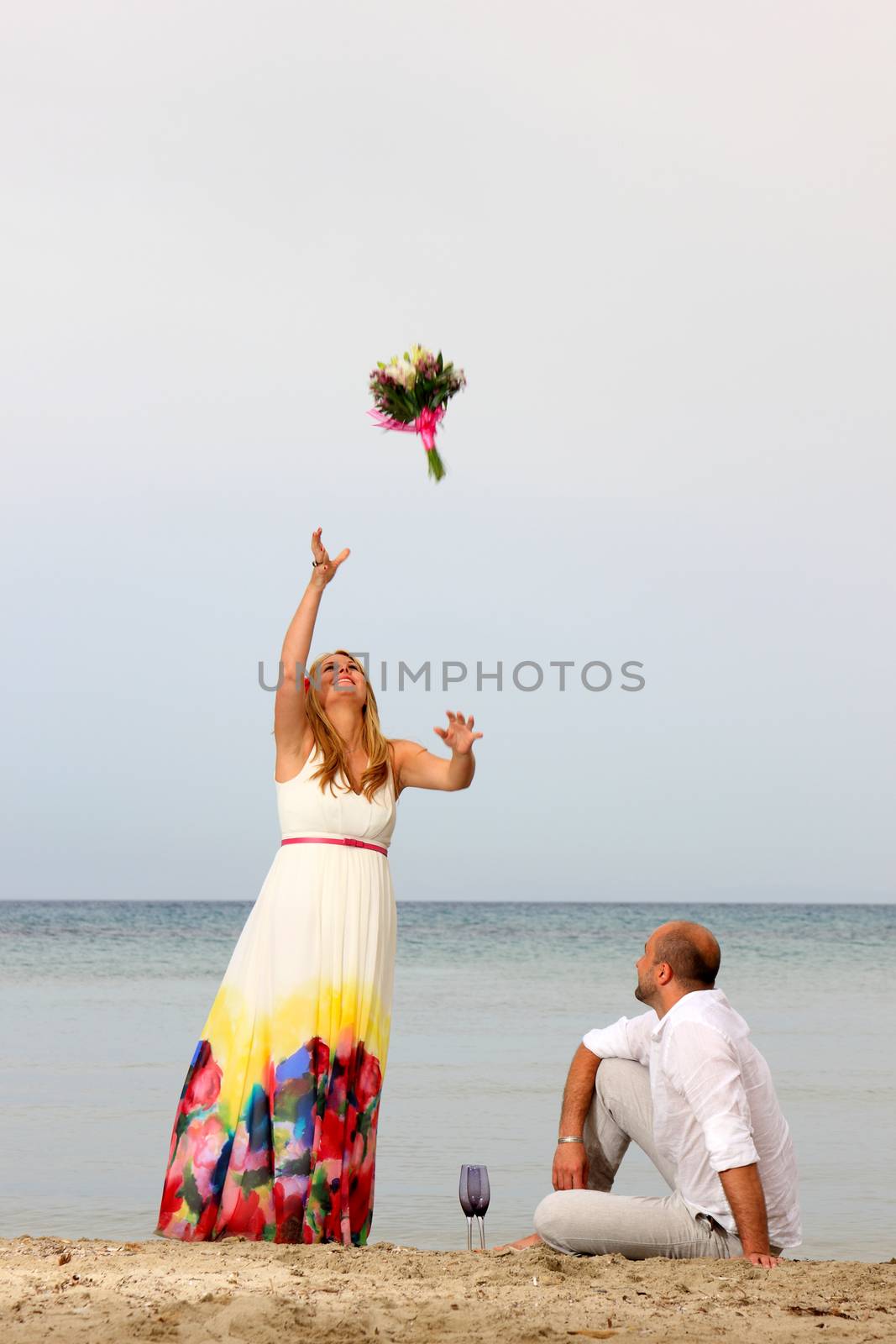 portrait of a young couple at the beach having romance
