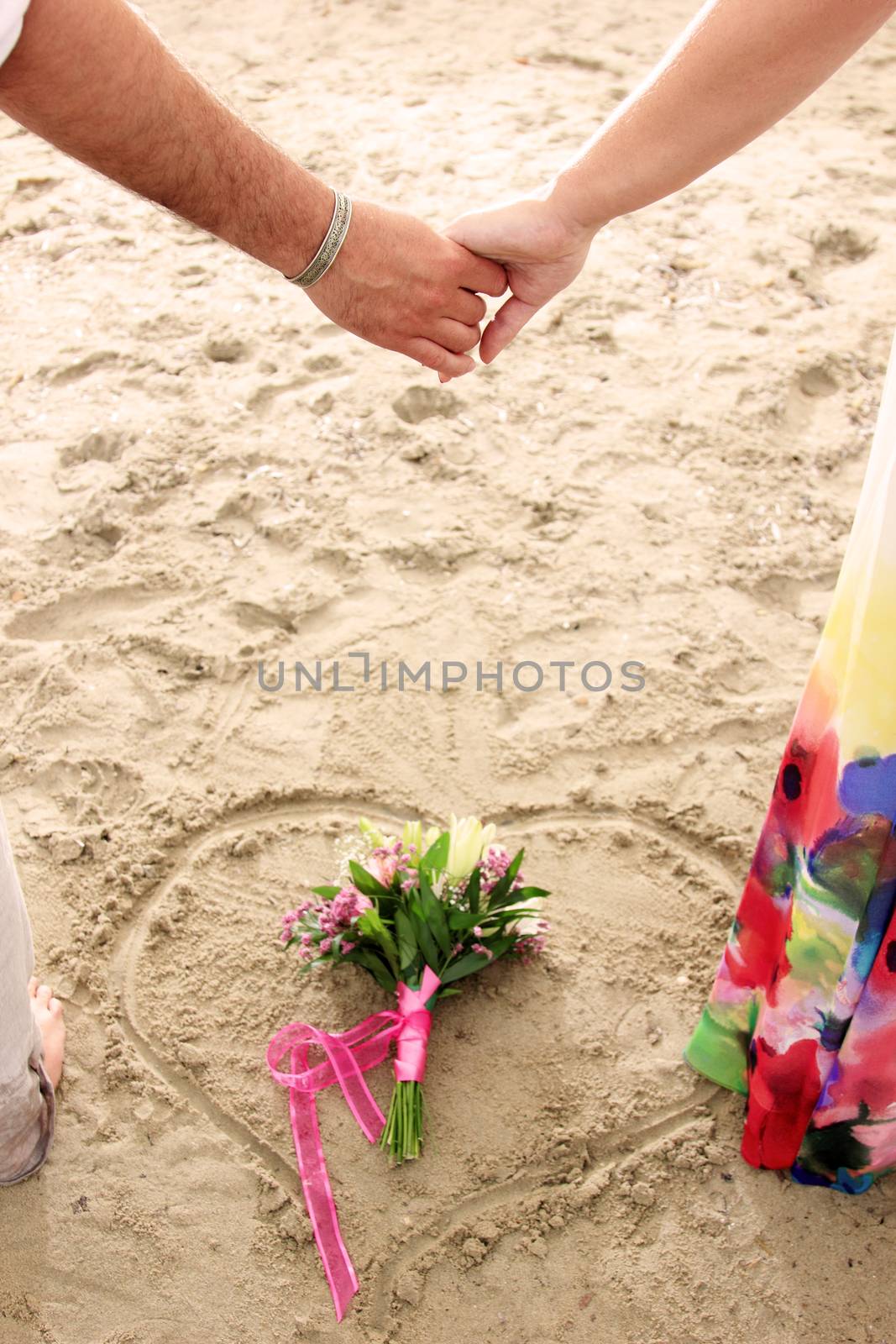 portrait of a young couple at the beach having romance
