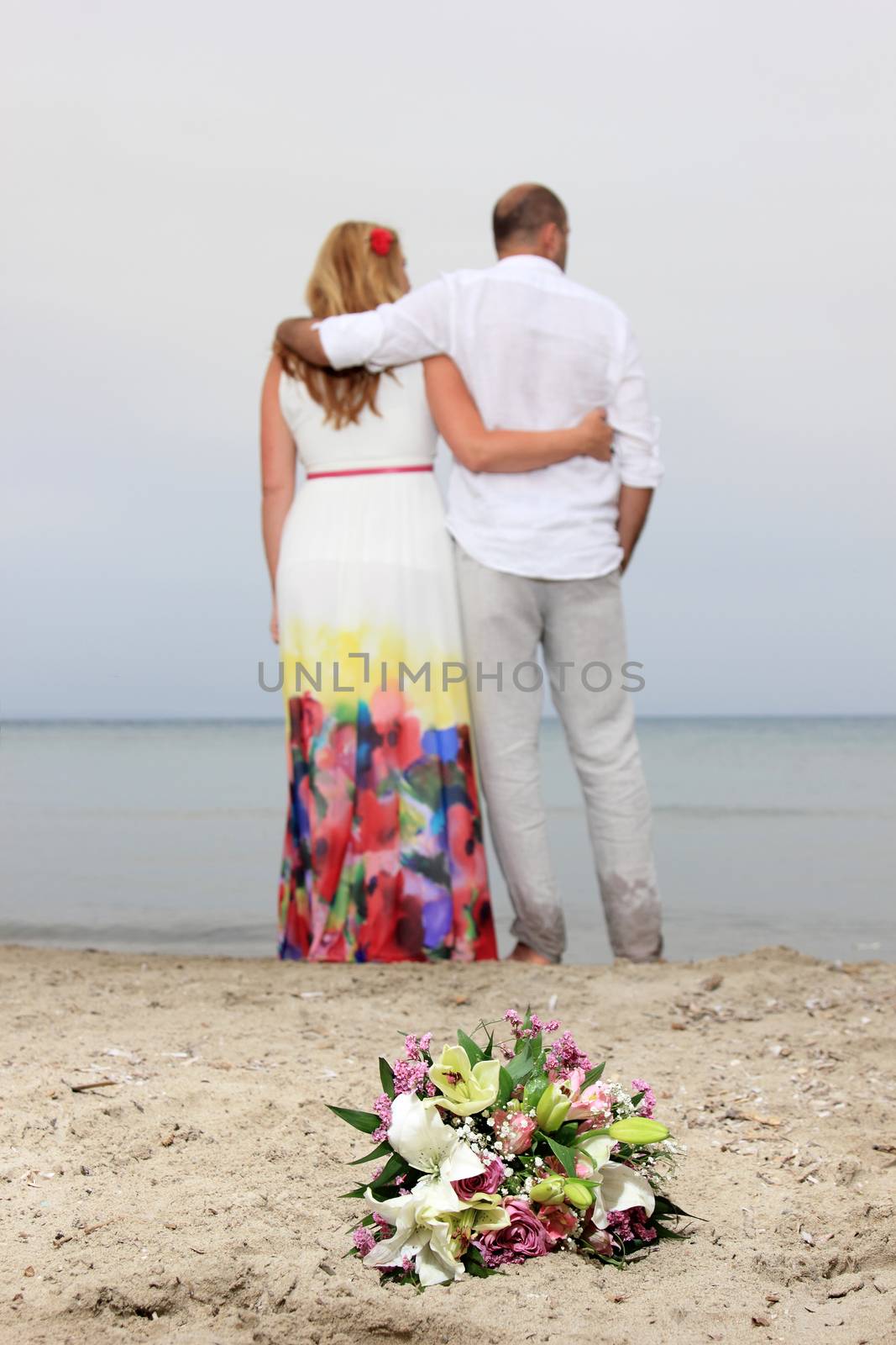 portrait of a young couple at the beach having romance
