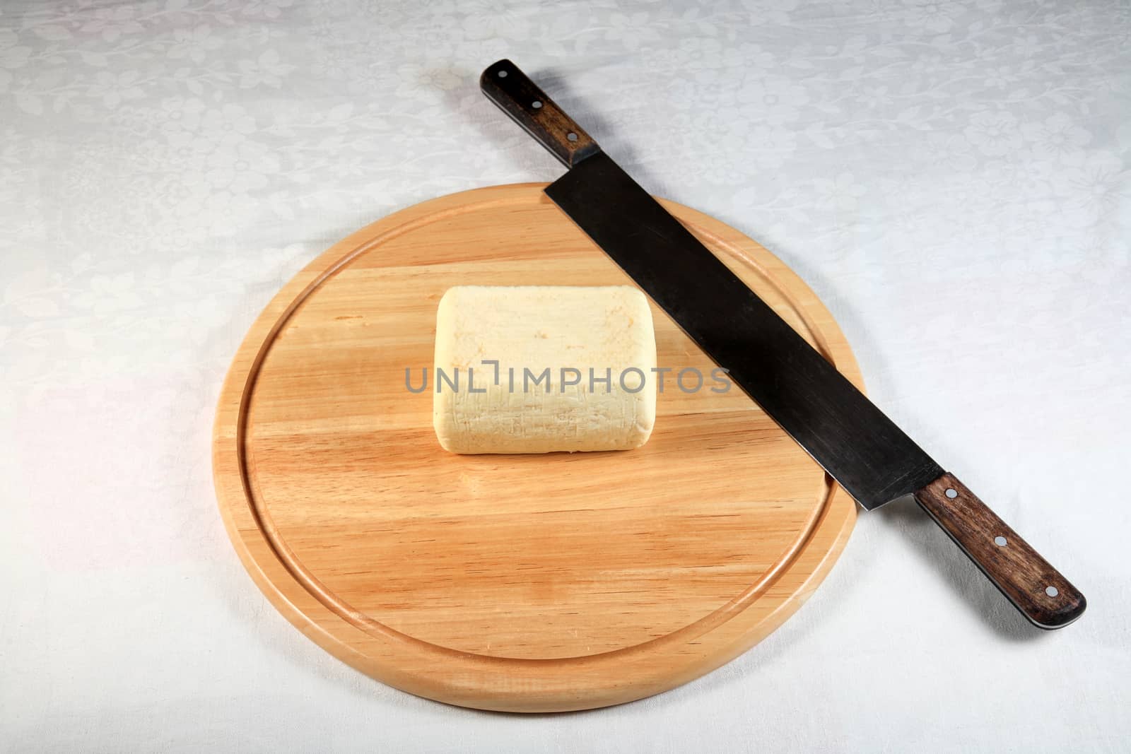 block of cheese on a wooden plate with decoration by smoxx