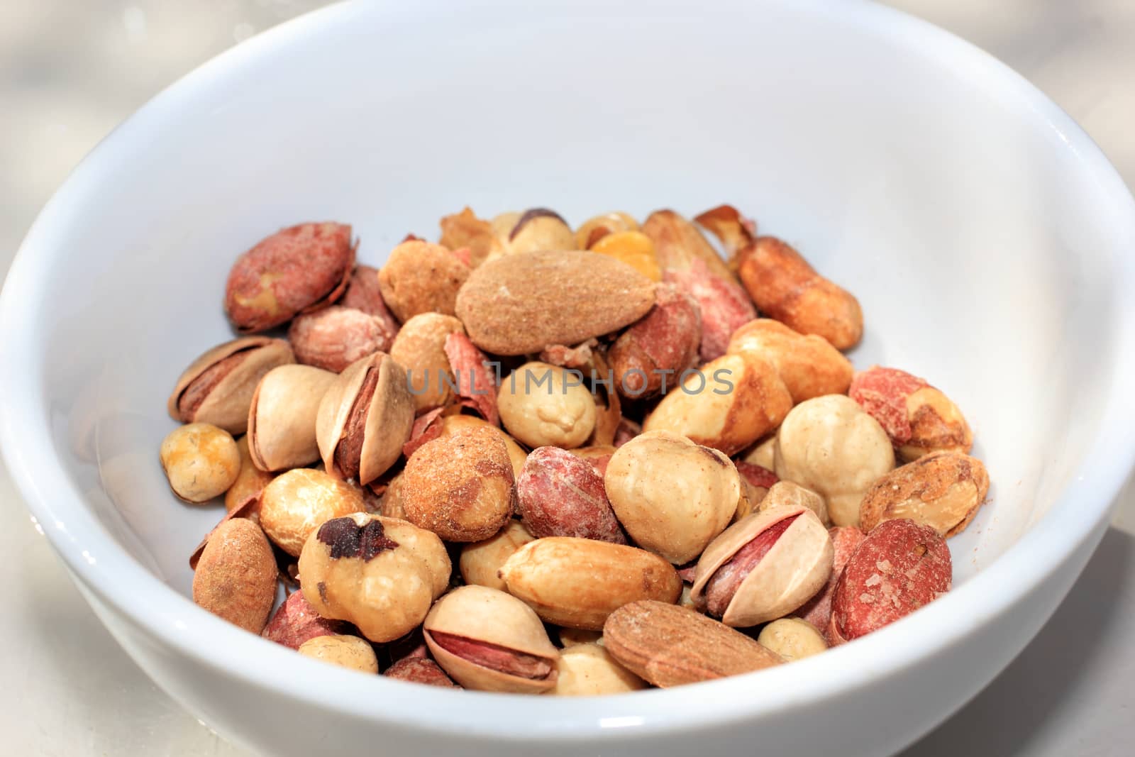 close up of roasted mix nuts on a bowl