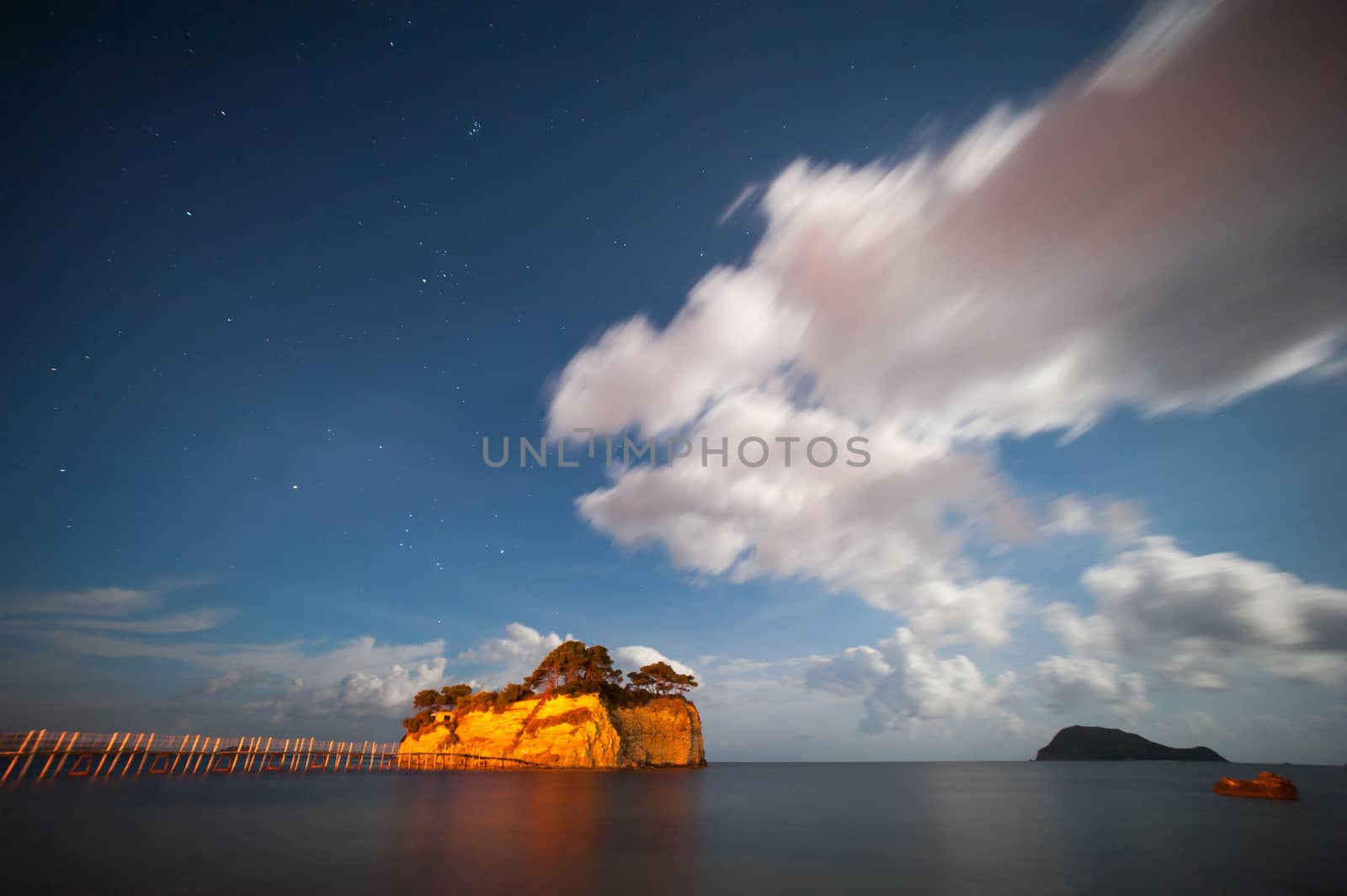 small island with bridge at night with clouds and moon light 