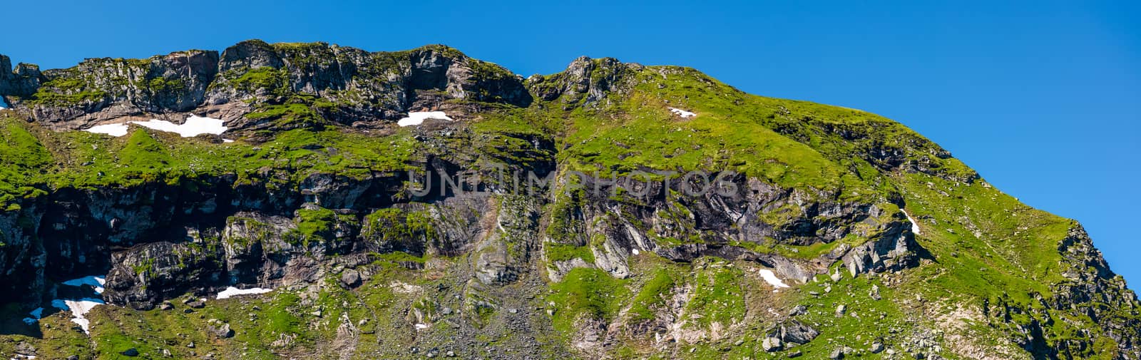 mountain ridge with rocky cliffs and grassy slopes by Pellinni