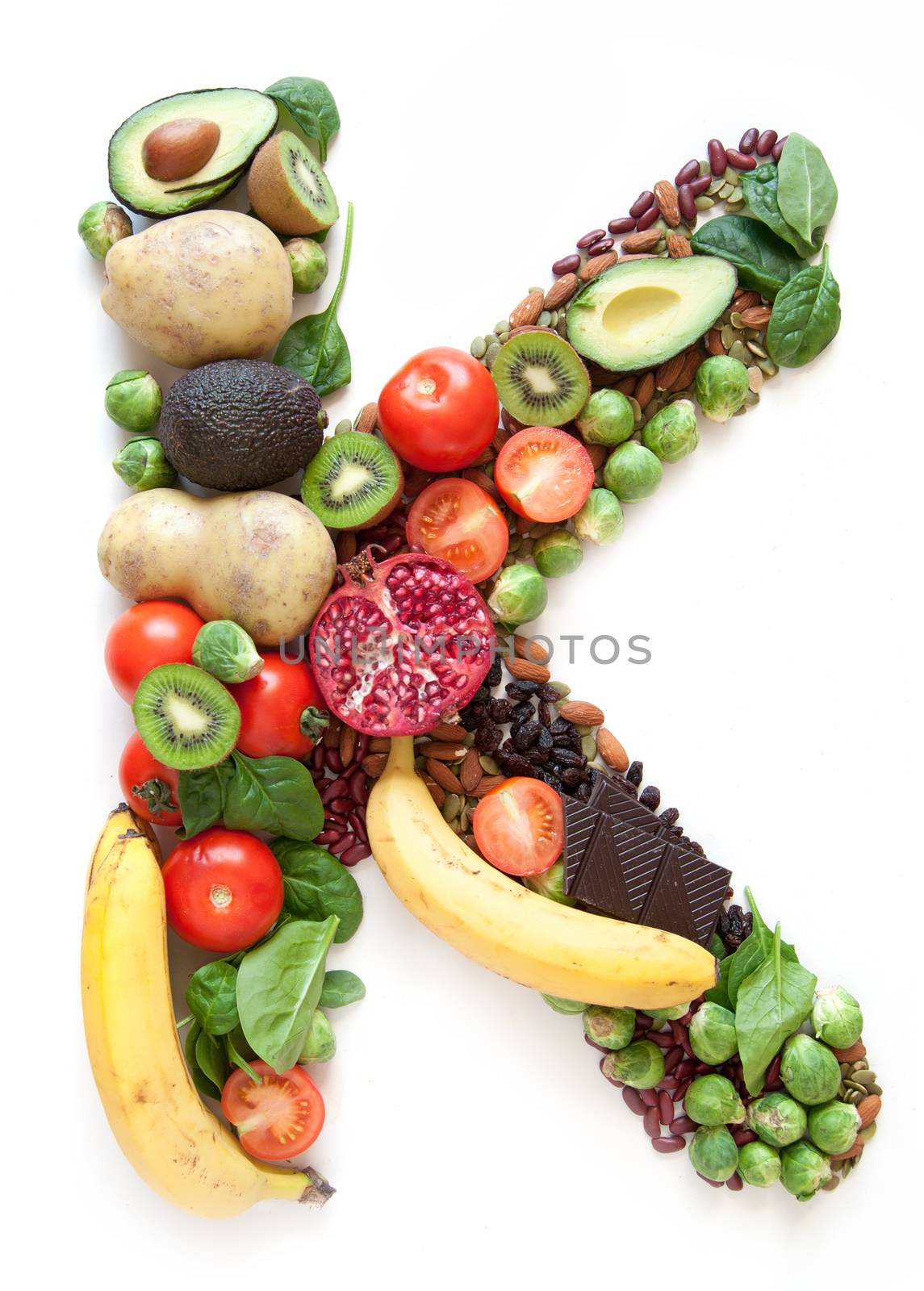 Magnesium symbol K  made of food over a white background