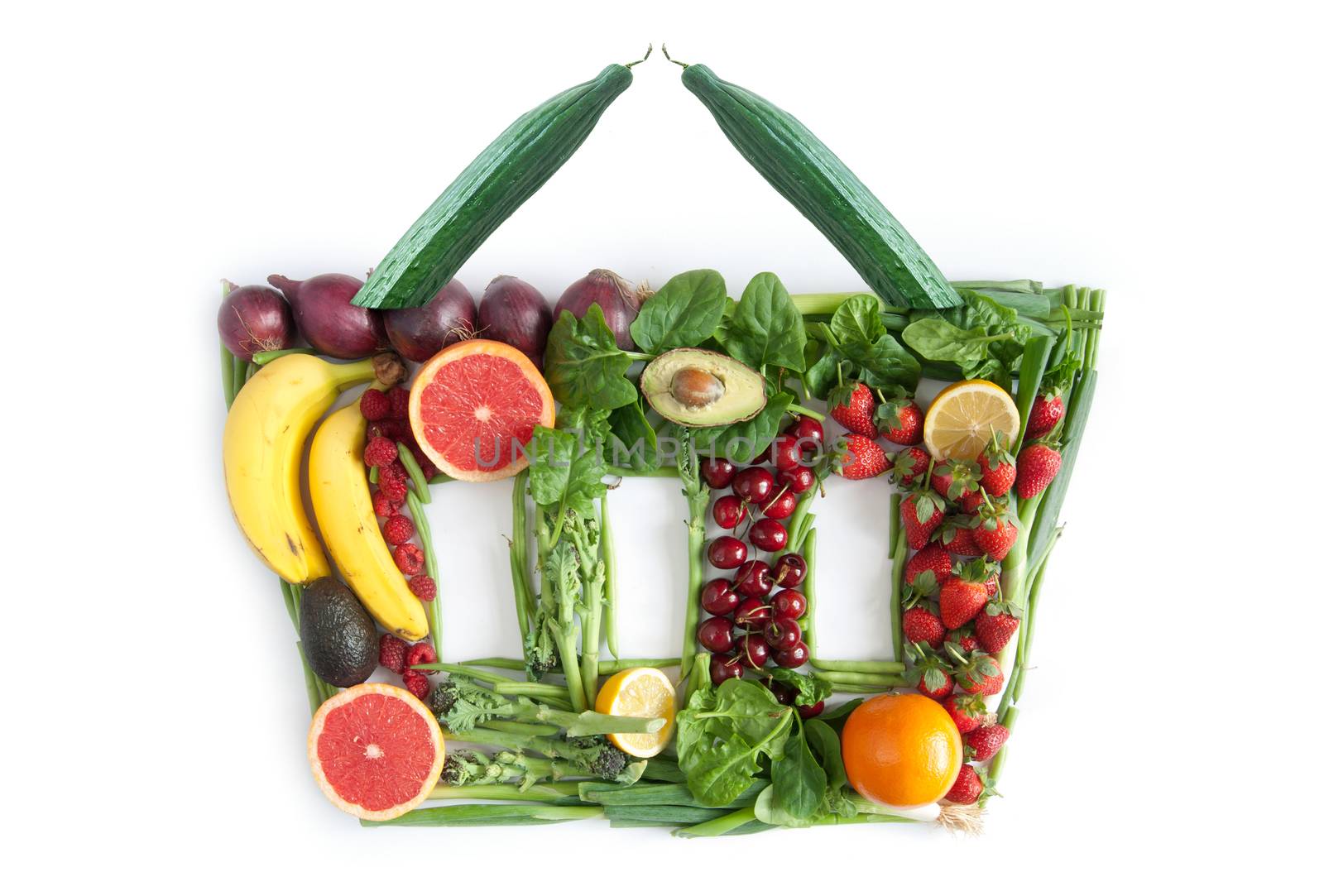 Fruits and vegetables in the shape of a grocery basket 