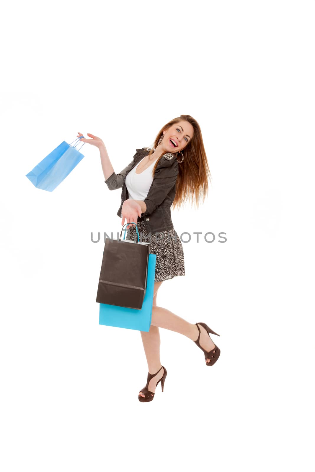 Beautiful young girl with shopping bags isolated on a white background by smoxx