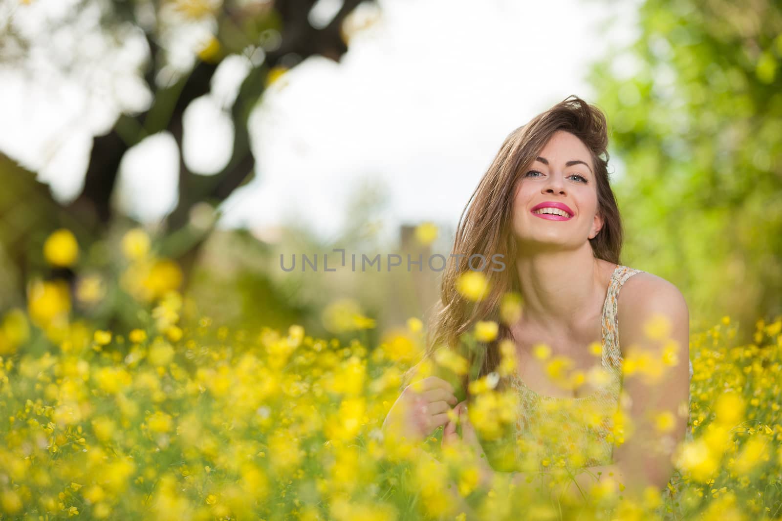 Beautiful young girl among yellow flowers by smoxx