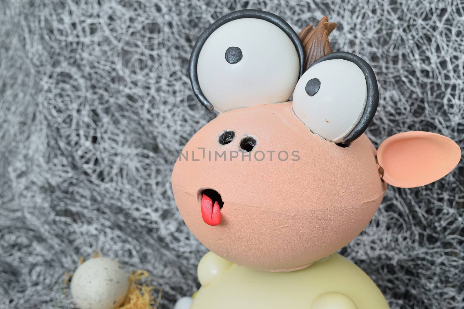 chocolate egg in the shape of a lamb with various decorations