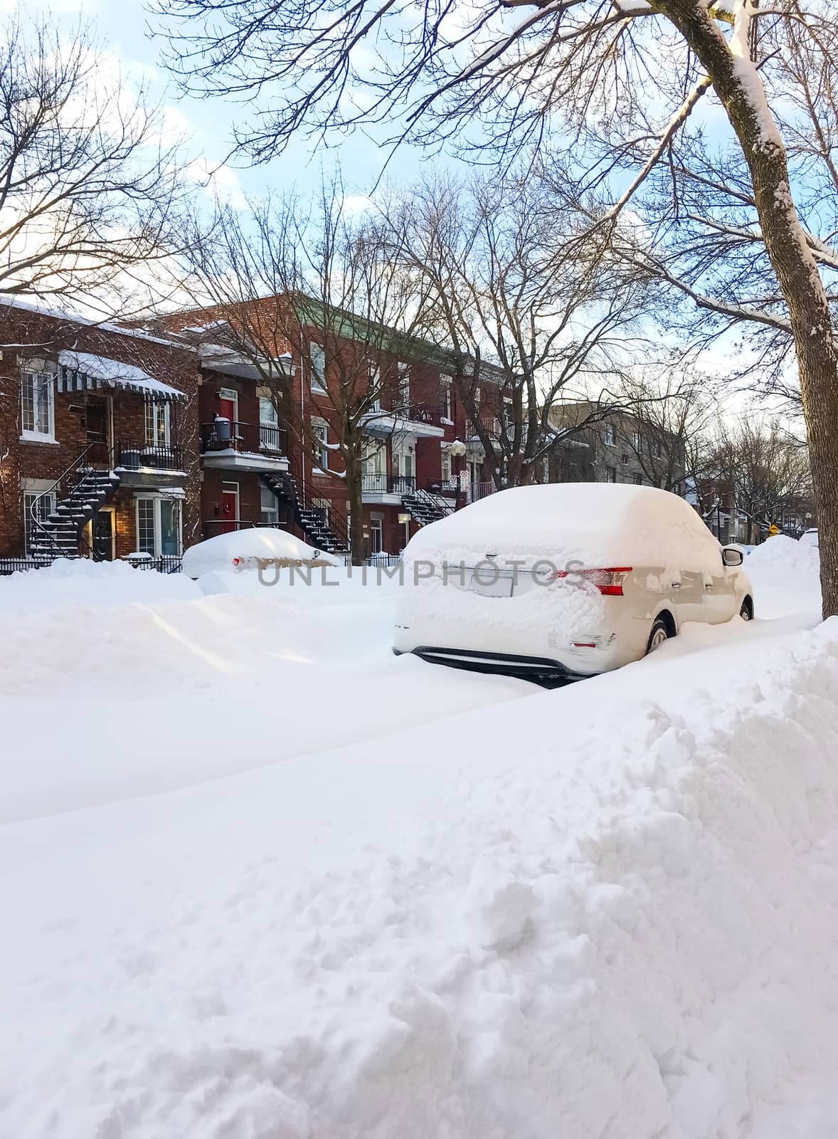 Urban winter street with lots of snow. Montreal, Quebec, Canada.