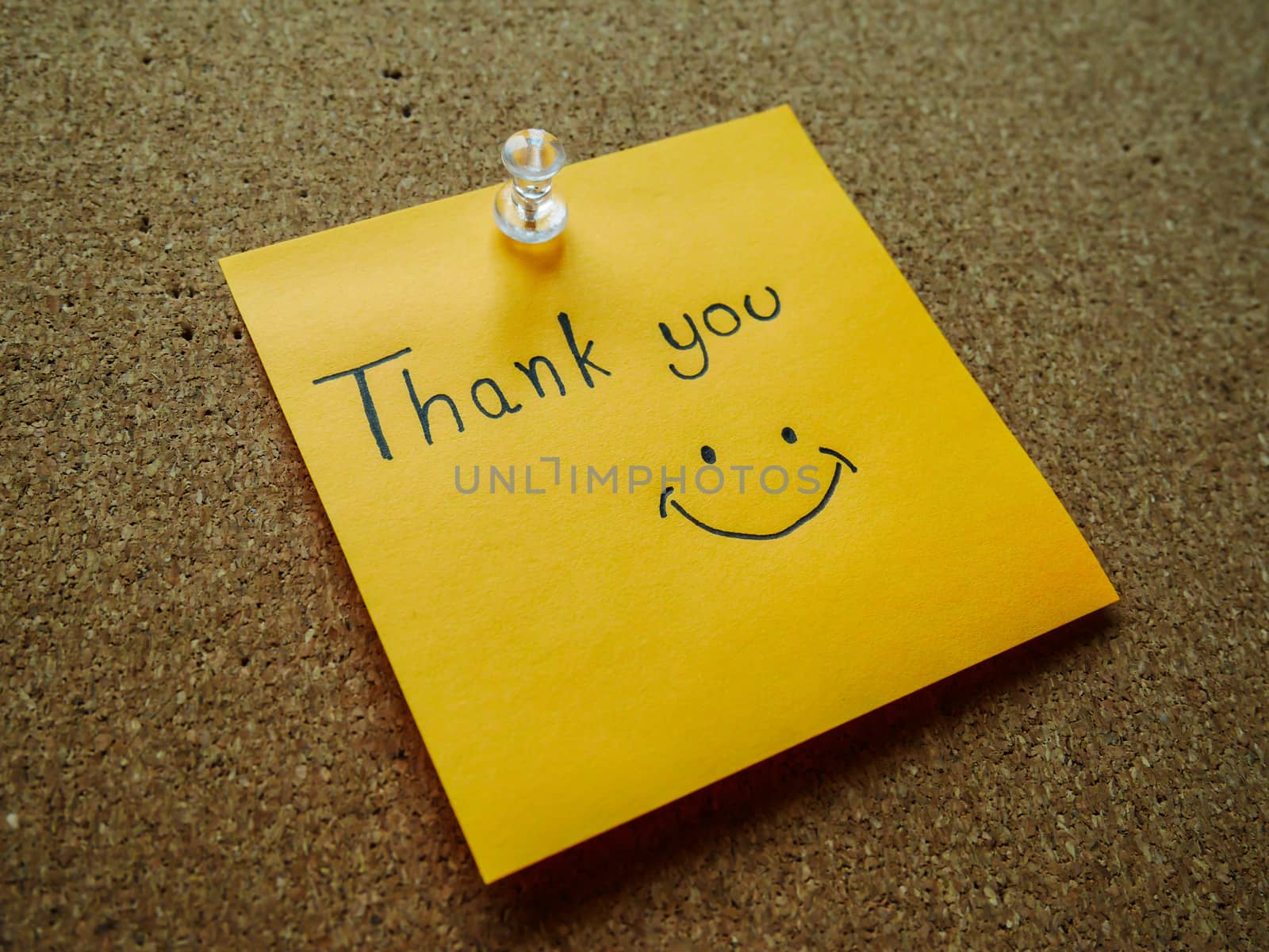 Writting "Thank you" on post it note for someone