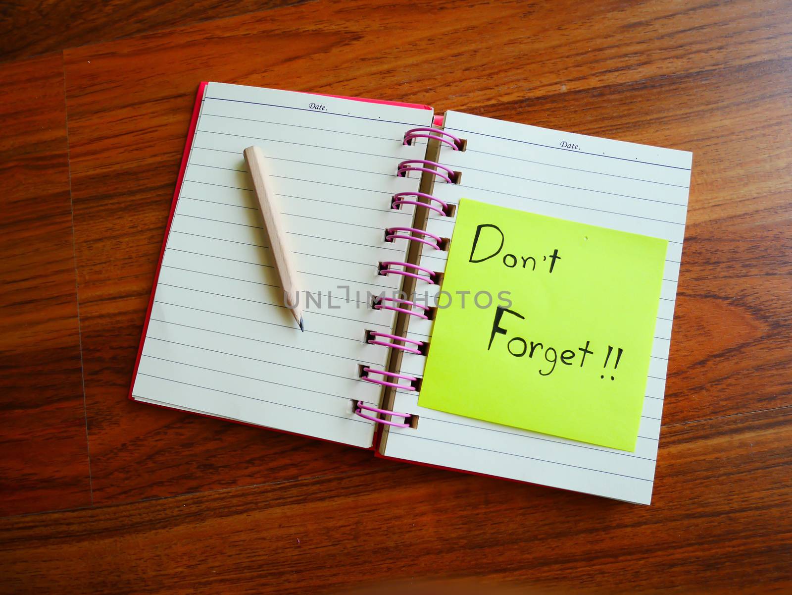 Don't forget post note with note book on top view