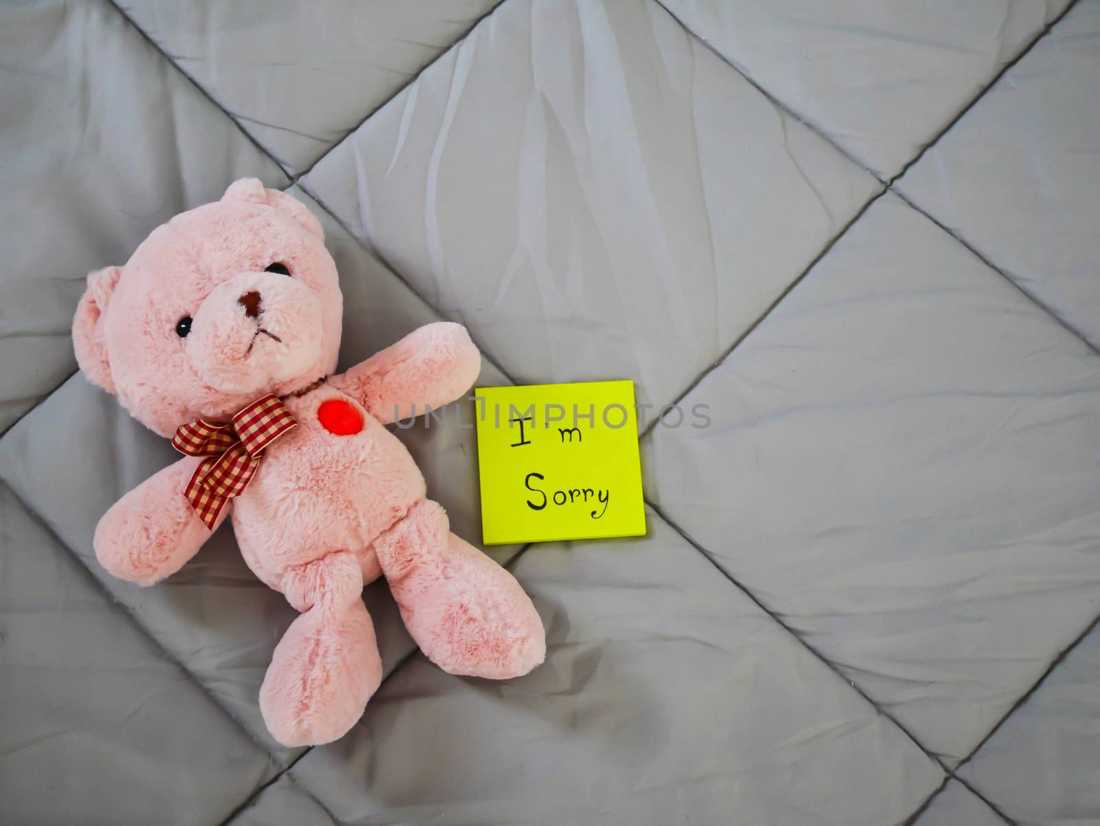I'm sorry on post it with teddy doll on bed