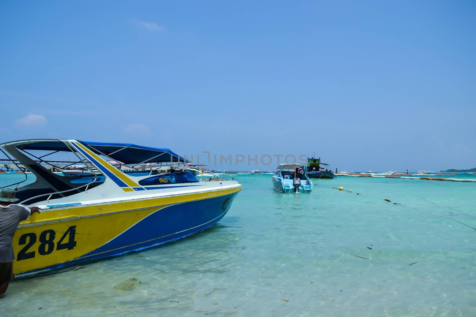 Speedboat on koh larn beach in thailand