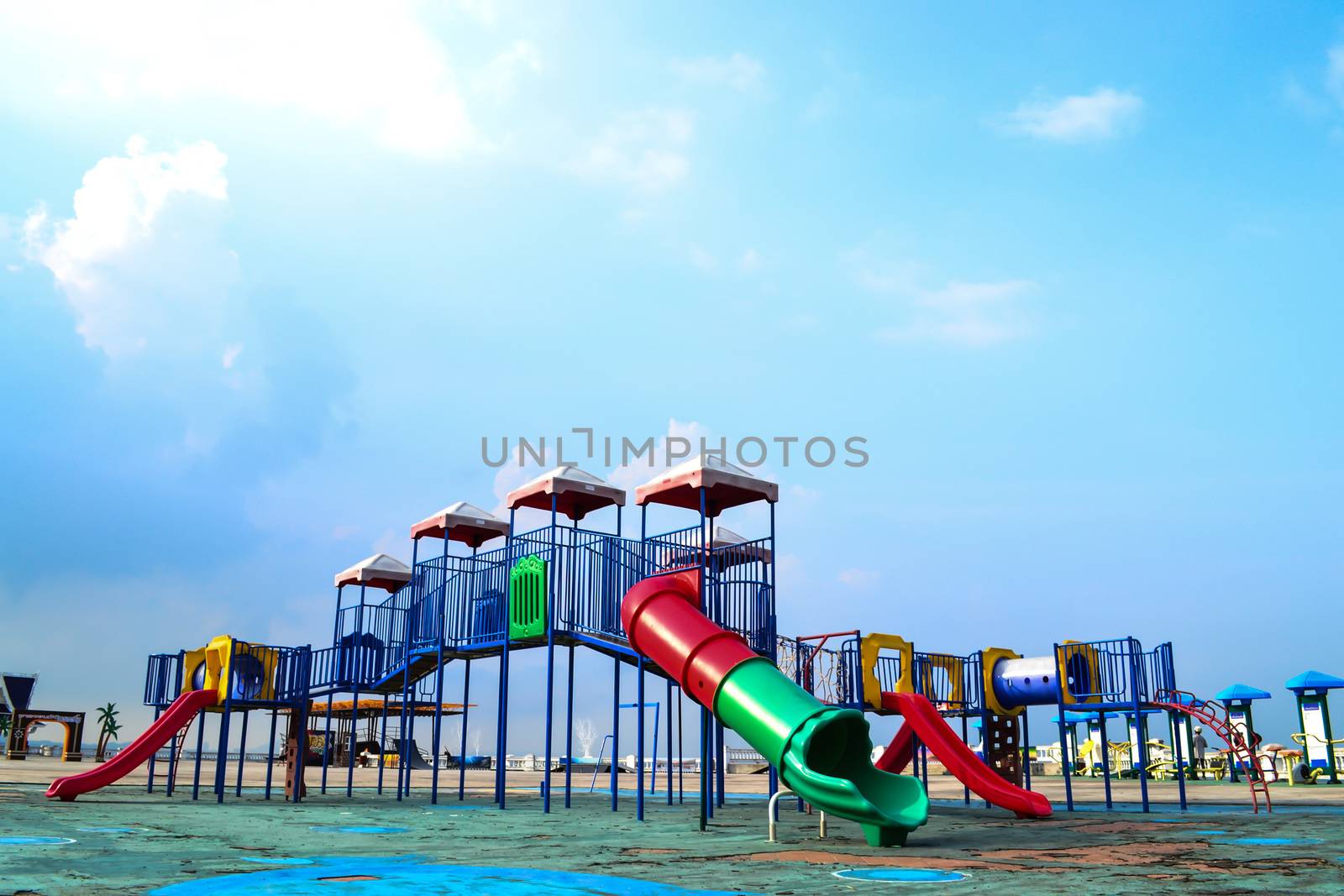 Colorful playground on blue sky background