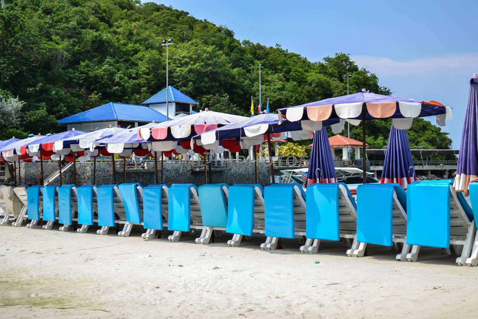 Beautiful blue beach chair prepare for tourism in thailand