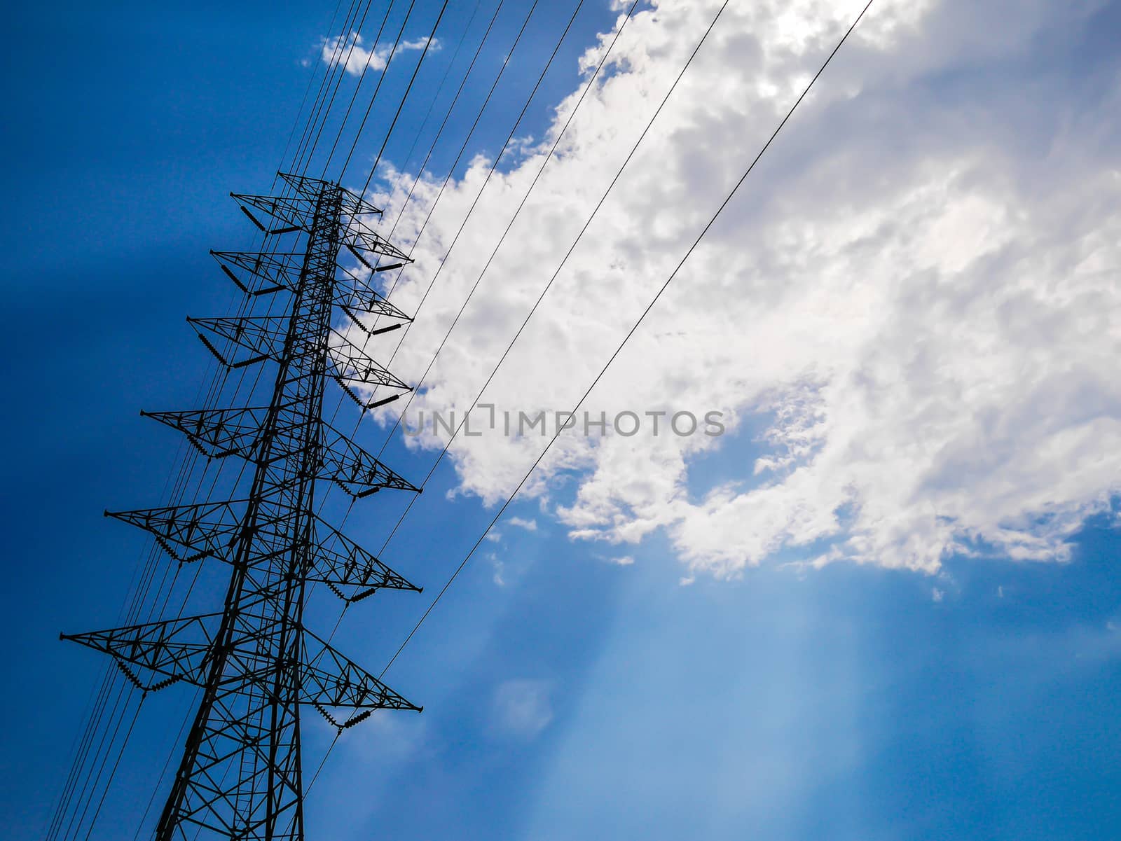 Electrical tower and sunlight on blue sky background