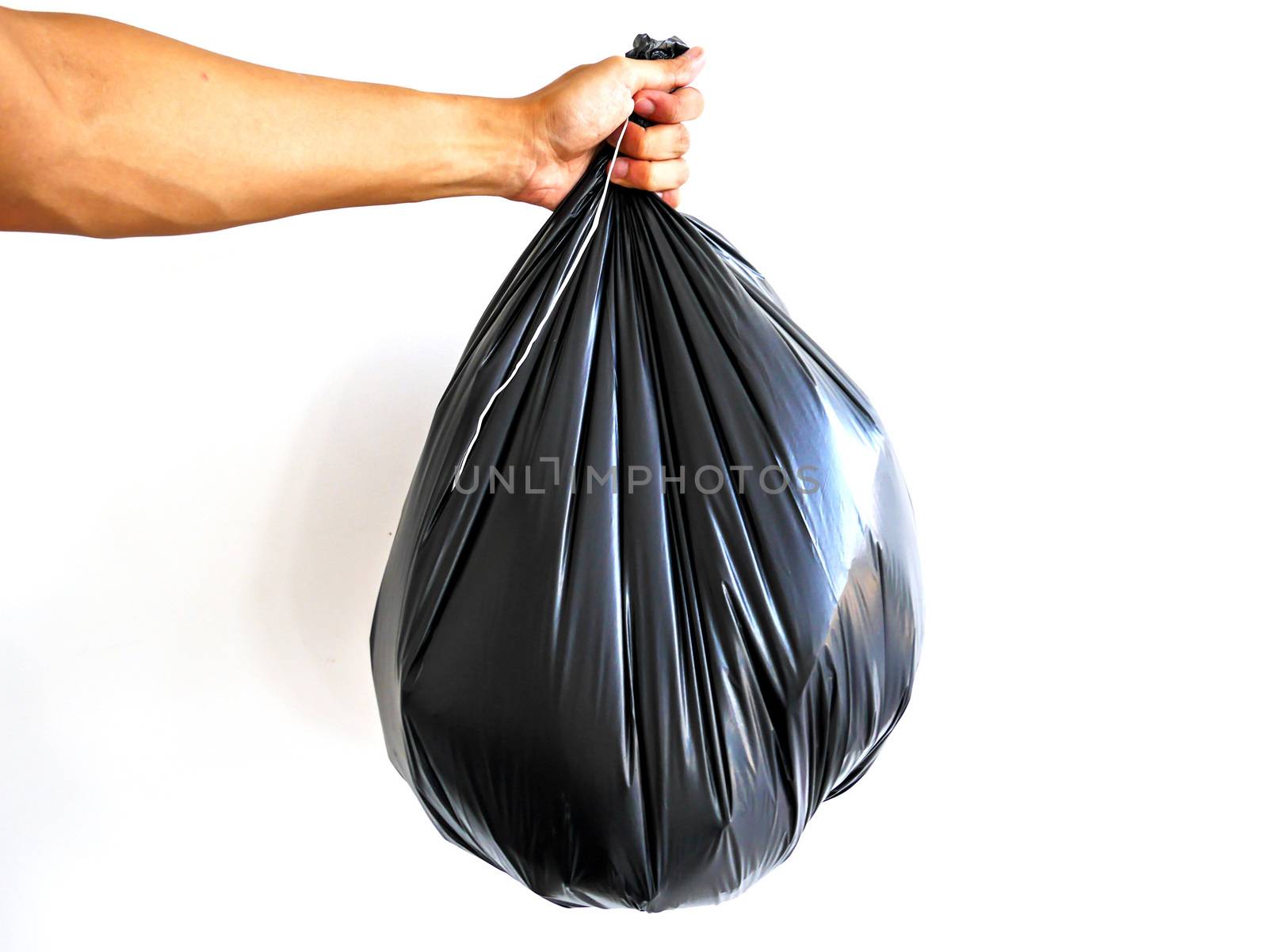 Right hand hold big garbage bag isolated on white background