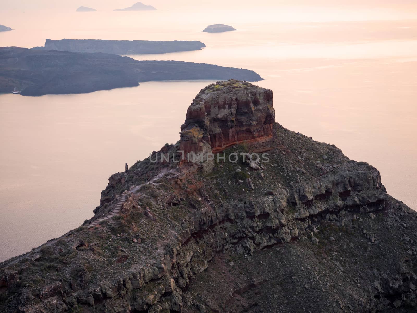 View of the sunset and the volcano of Santorini island in Cyclades,Greece