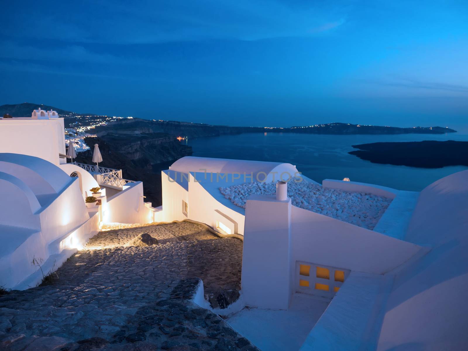 Small white houses with lights late in the afternoon in Santorini island in Cyclades,Greece