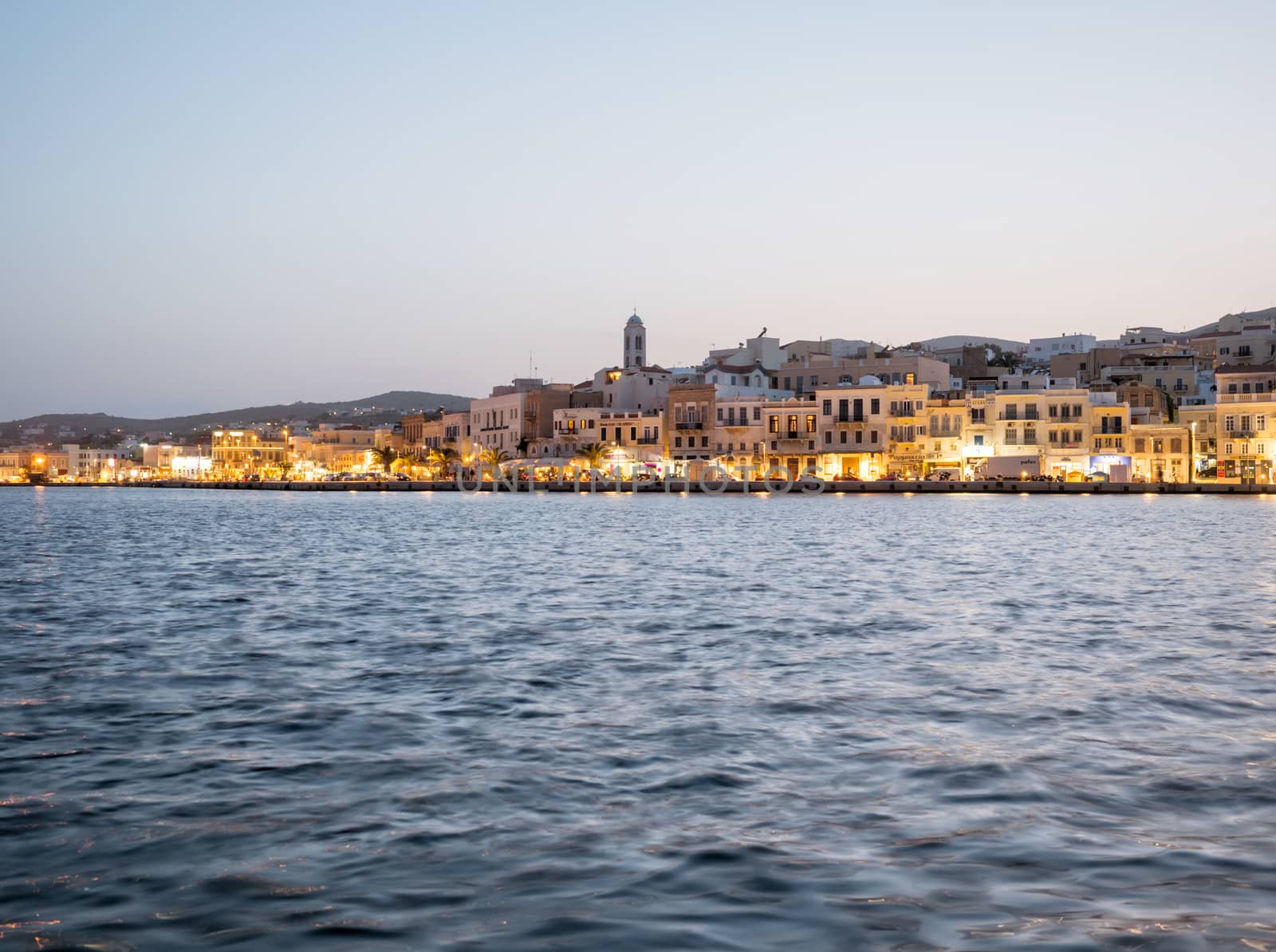 View of Syros town with beautiful buildings and houses in the afternoon