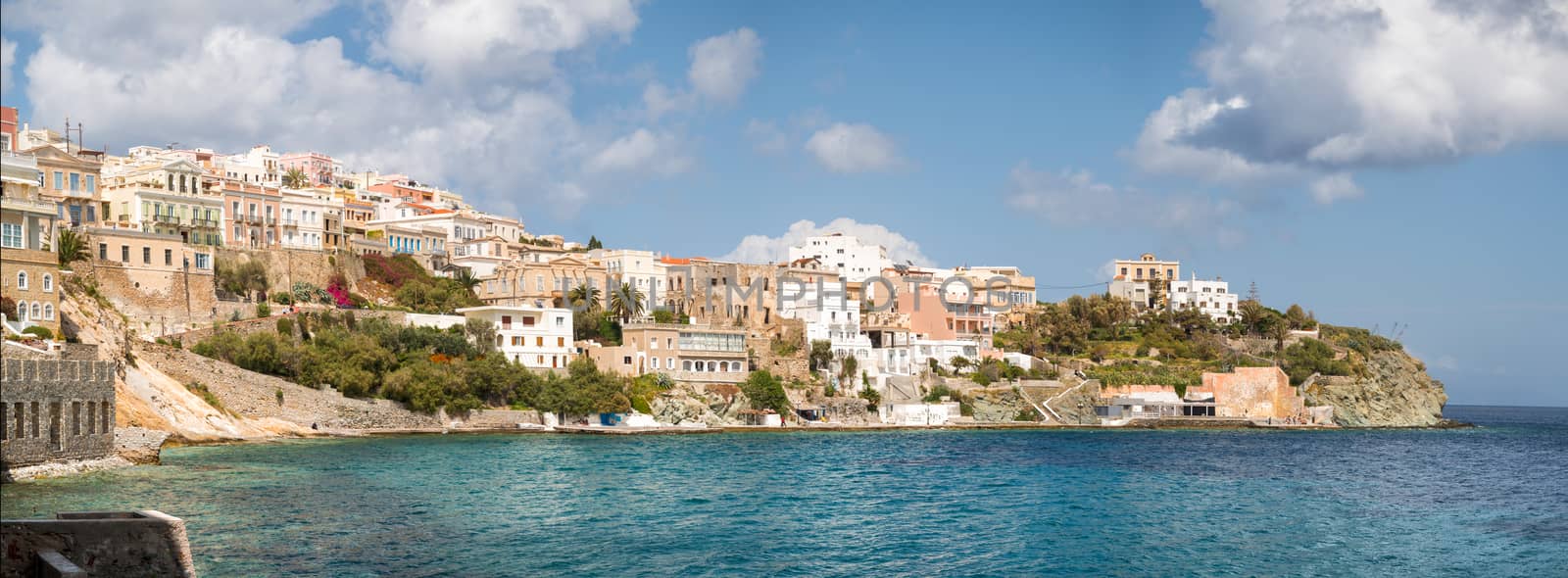 View of Syros town with beautiful buildings and houses  in a sunny day