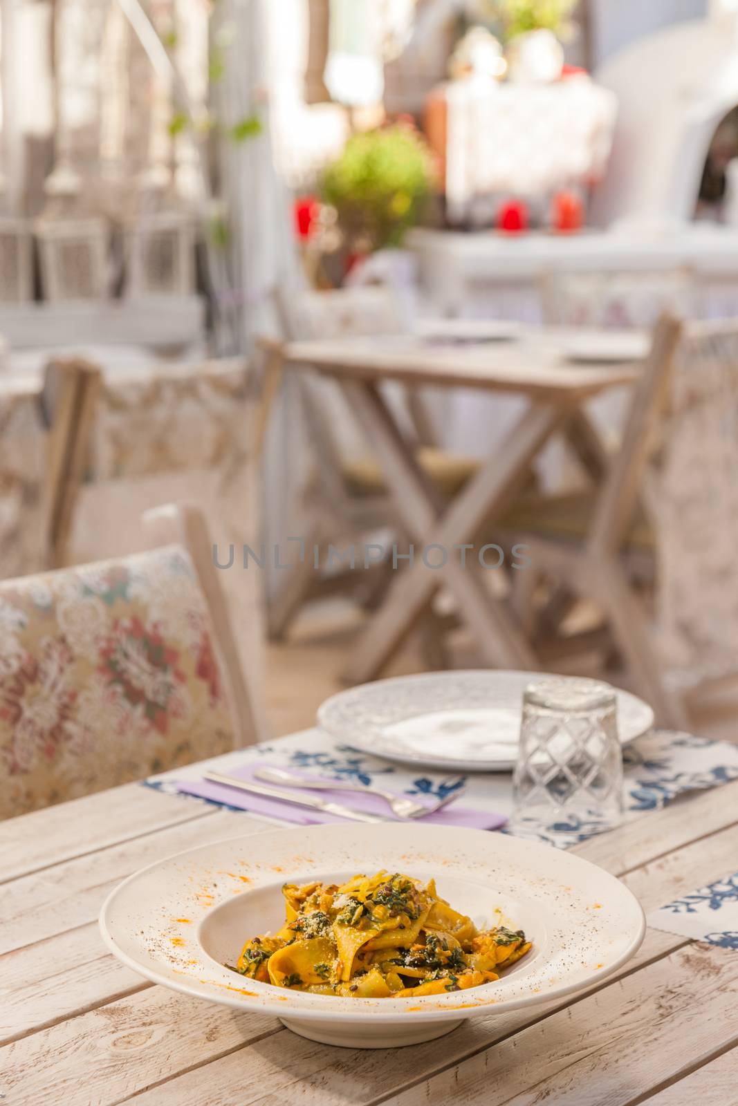 Gourmet fresh pasta with lentil served on a white plate