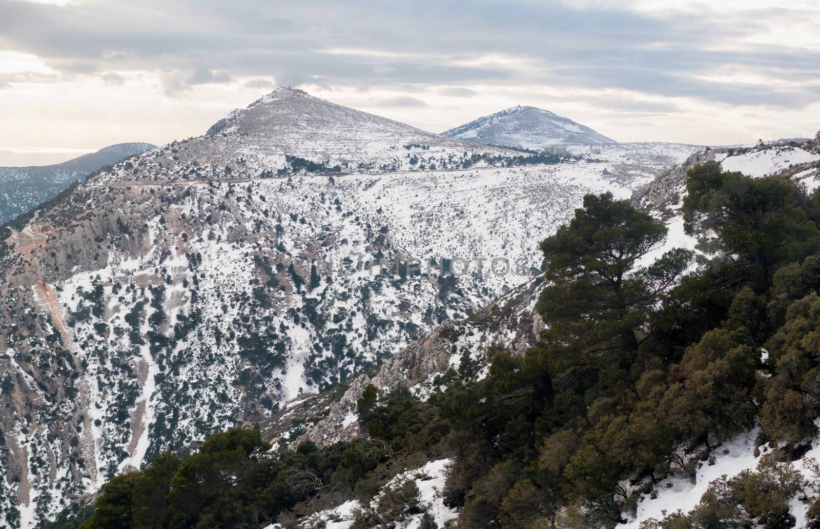Panoramic view of Parnitha mountain landscape with snow and cloudy sky, Athens, Greece