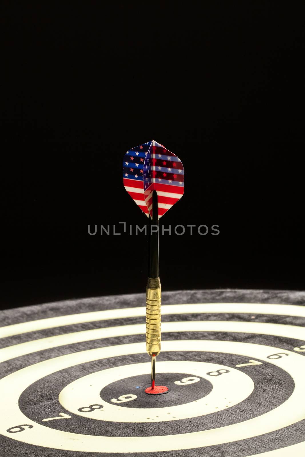 Indoor game Darts on a black studio background