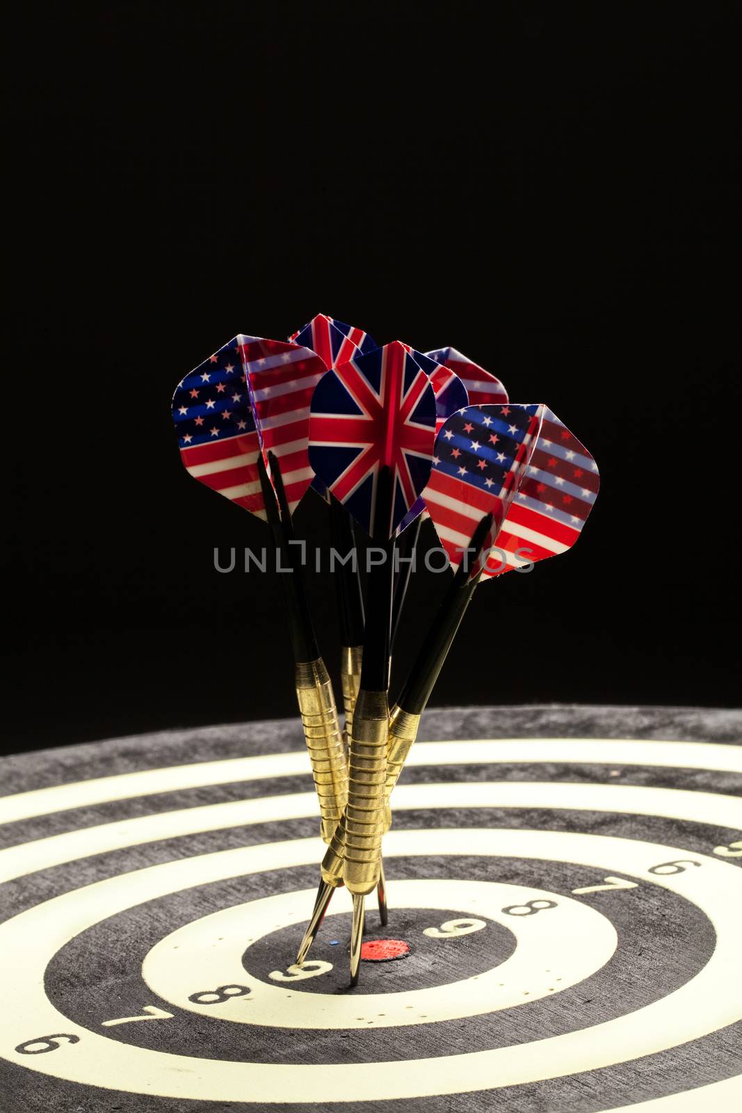 Indoor game Darts on a black studio background