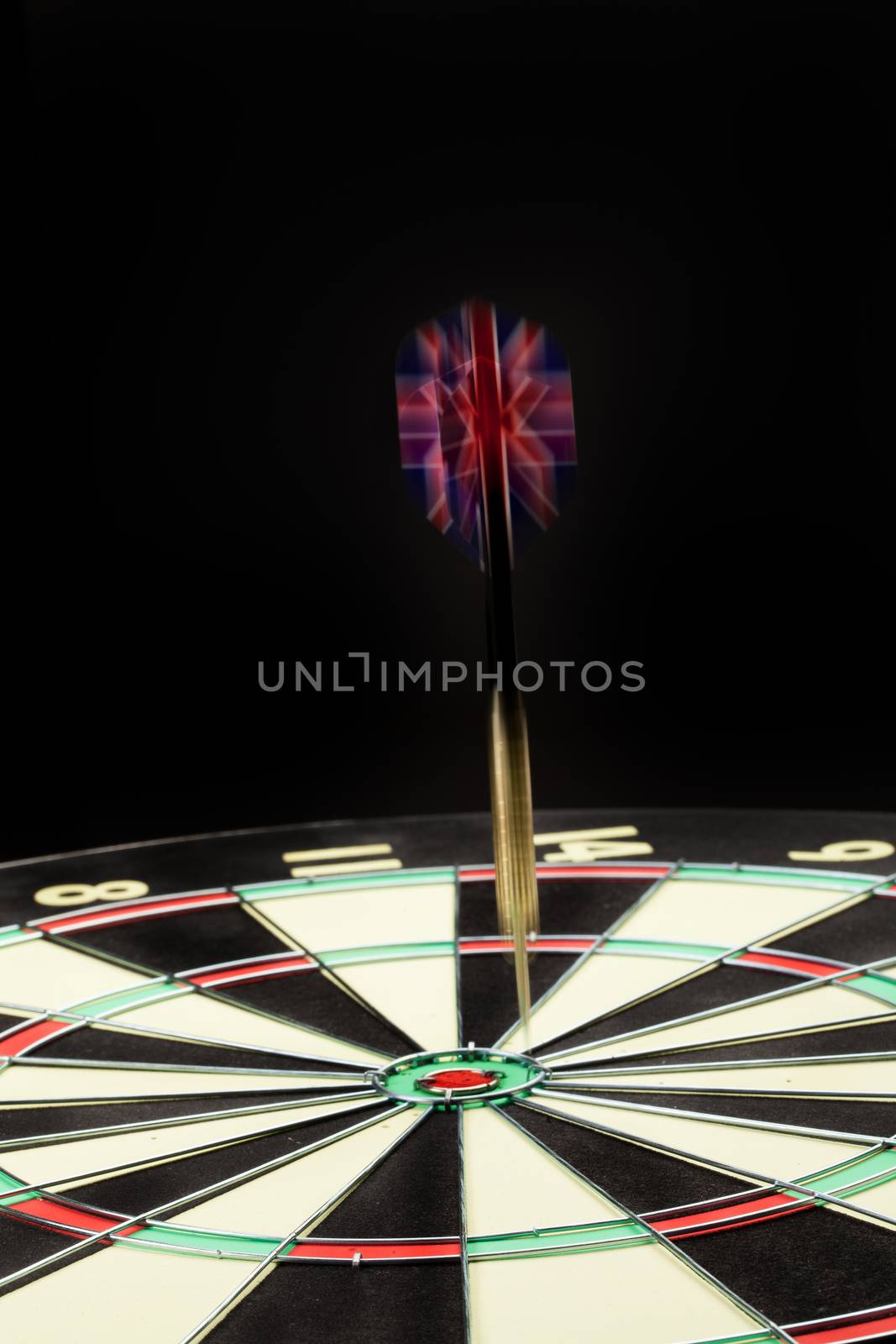 Indoor game Darts on a black studio background
